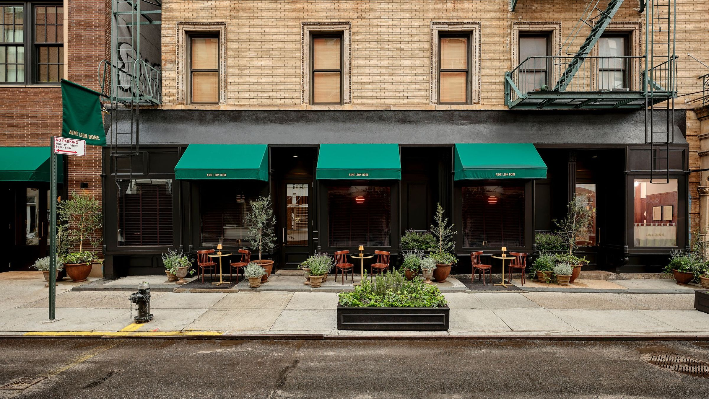Sidewalk view of Café Leon Dore and 214 Private lounge space on Mulberry Street in New York City 