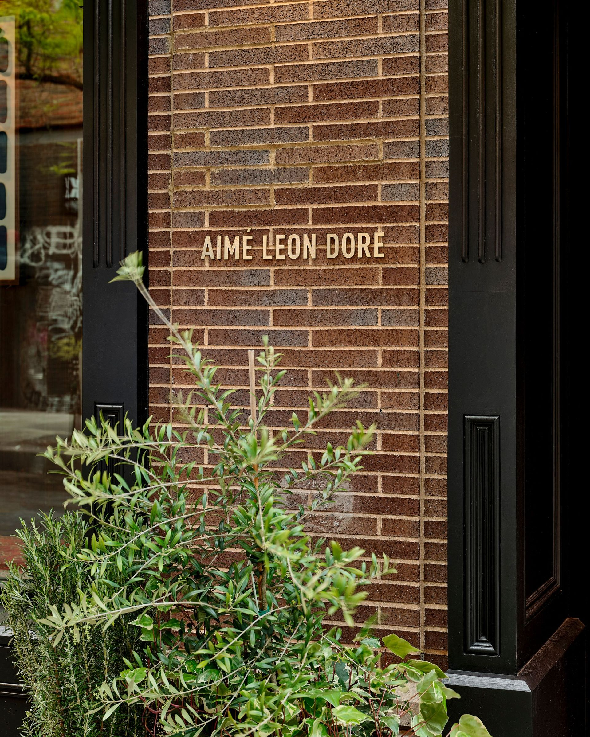 Close up of Aimé Leon Dore sign outside of New York City flagship