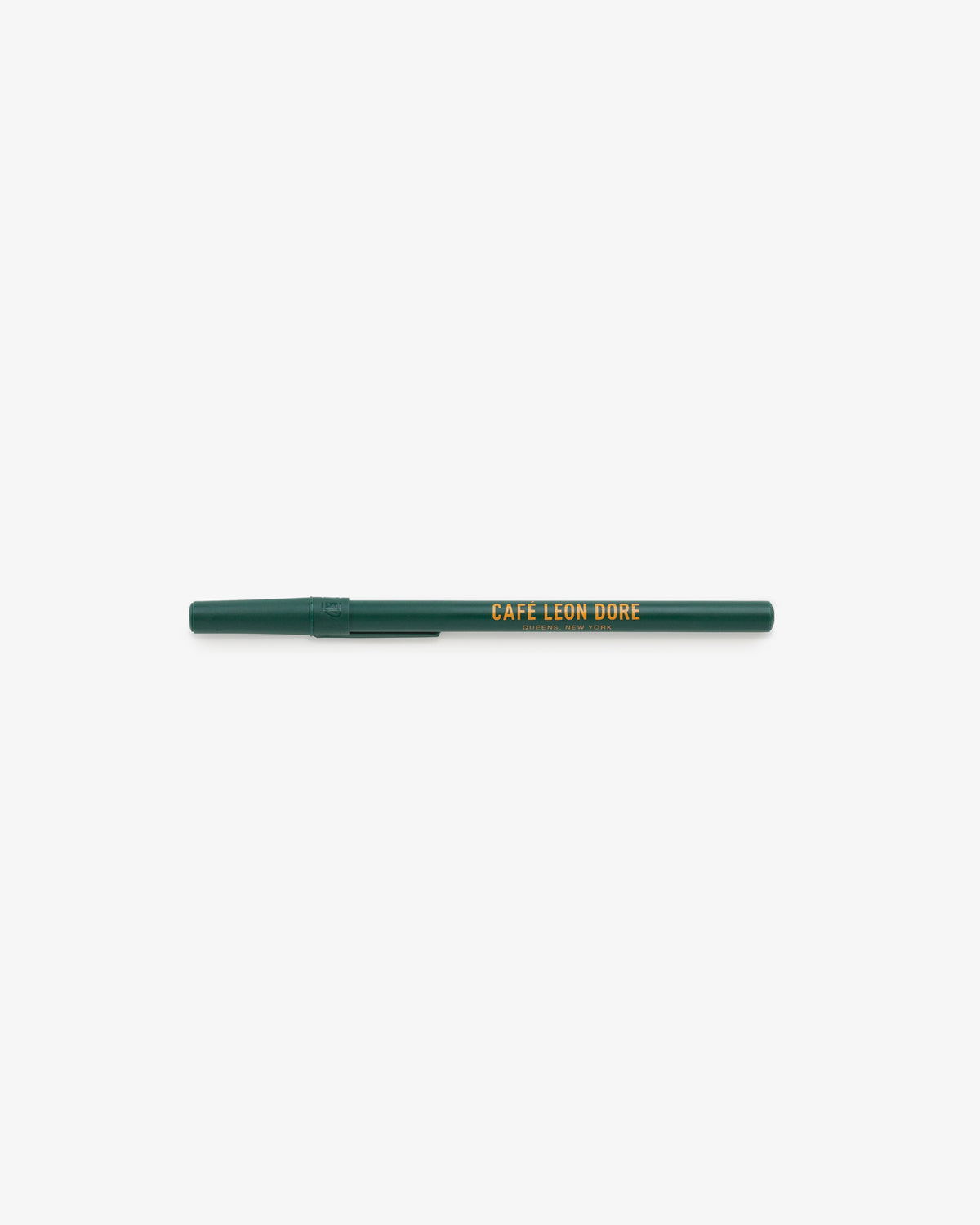 A green Café Leon Dore Ballpoint Pen with a yellow logo and cap, shown on a white background.