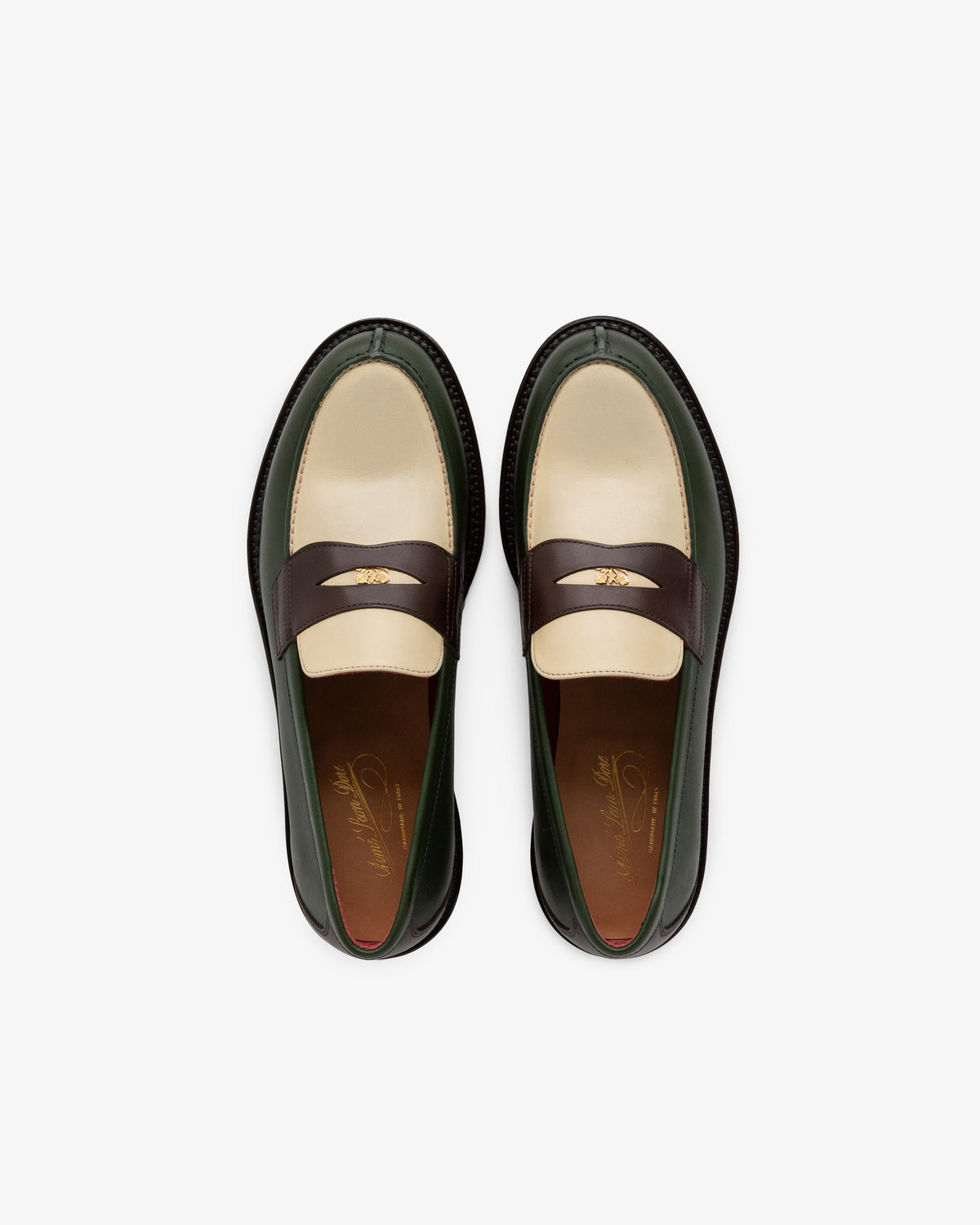 Top view of Queens Crest Loafer in cream, brown, and green leather with gold strap detailing.