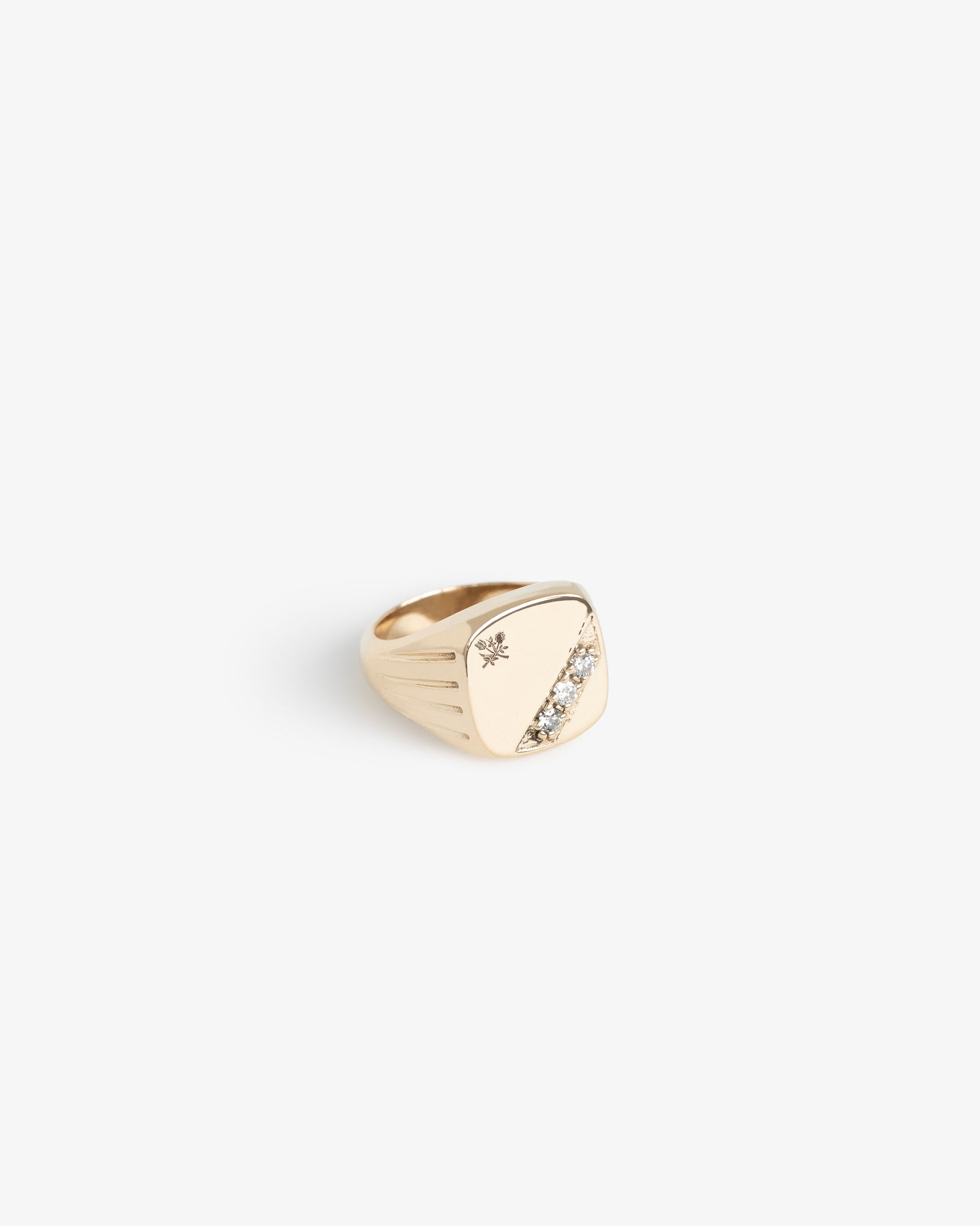14Kt Gold Diamond Signet Ring featuring a diagonal diamond row and star engraving, shown on a white background.