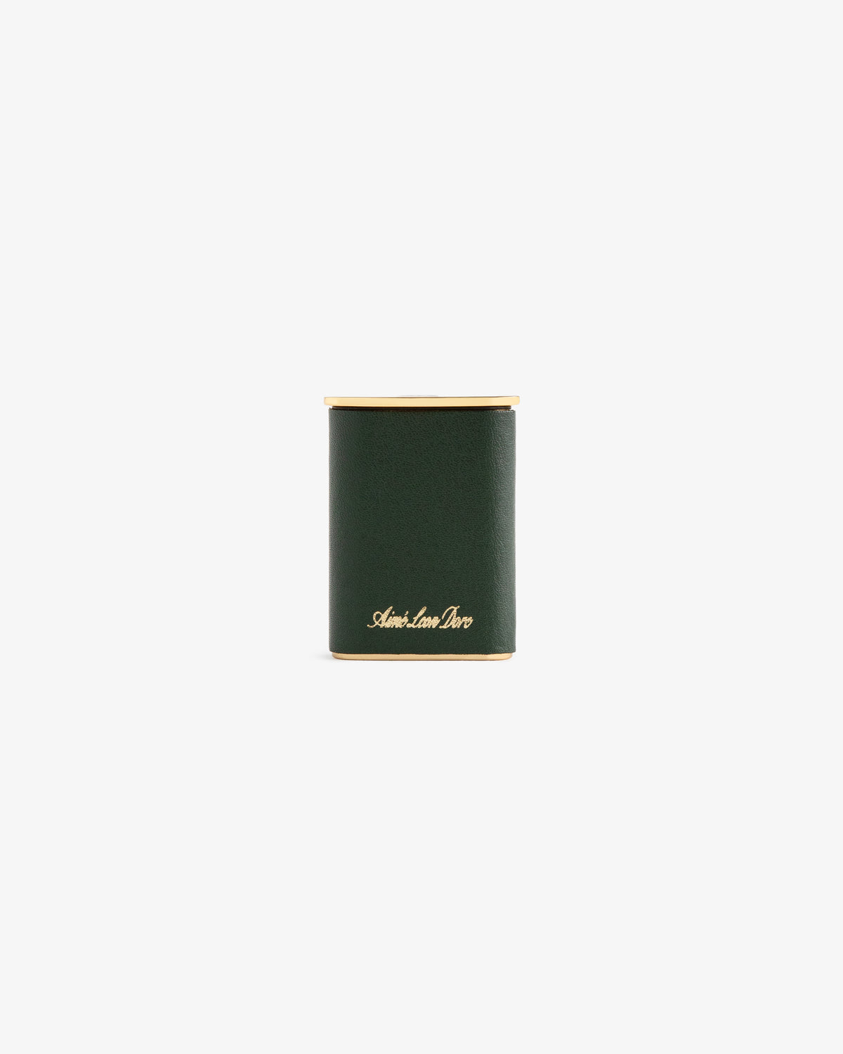 A dark green cylindrical Queens Crest Leather Portable Ashtray with gold accents and “Smythson” in gold script on front.