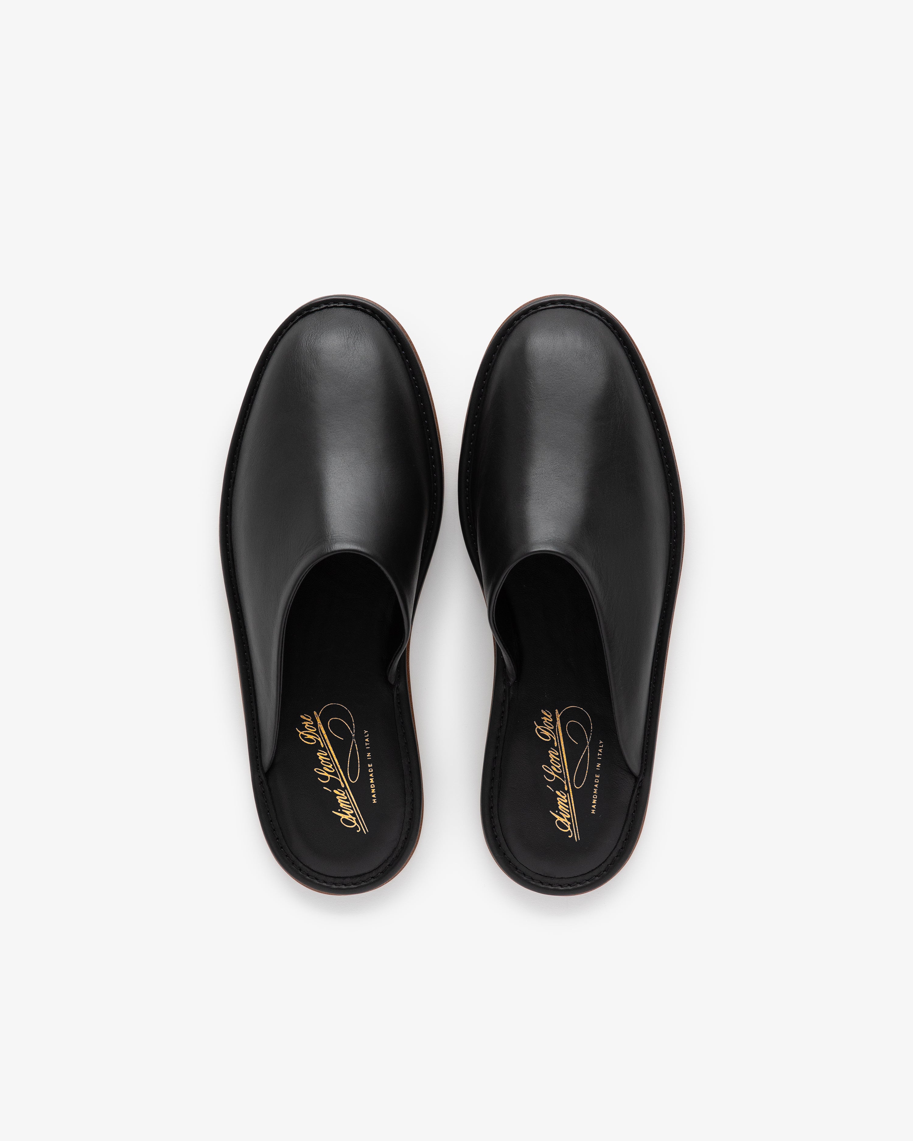 Leather Travel Slipper in black leather, slip-on style, shown from above on a white background.