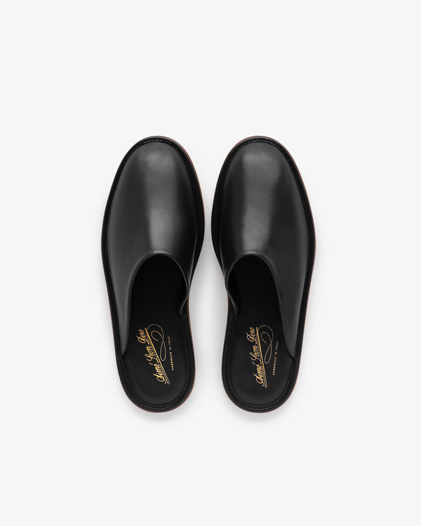 Leather Travel Slipper in black leather, slip-on style, shown from above on a white background.