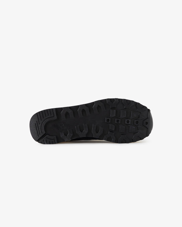 ALD / New Balance 475 black rubber sole with textured tread, shown from the bottom on a white background.