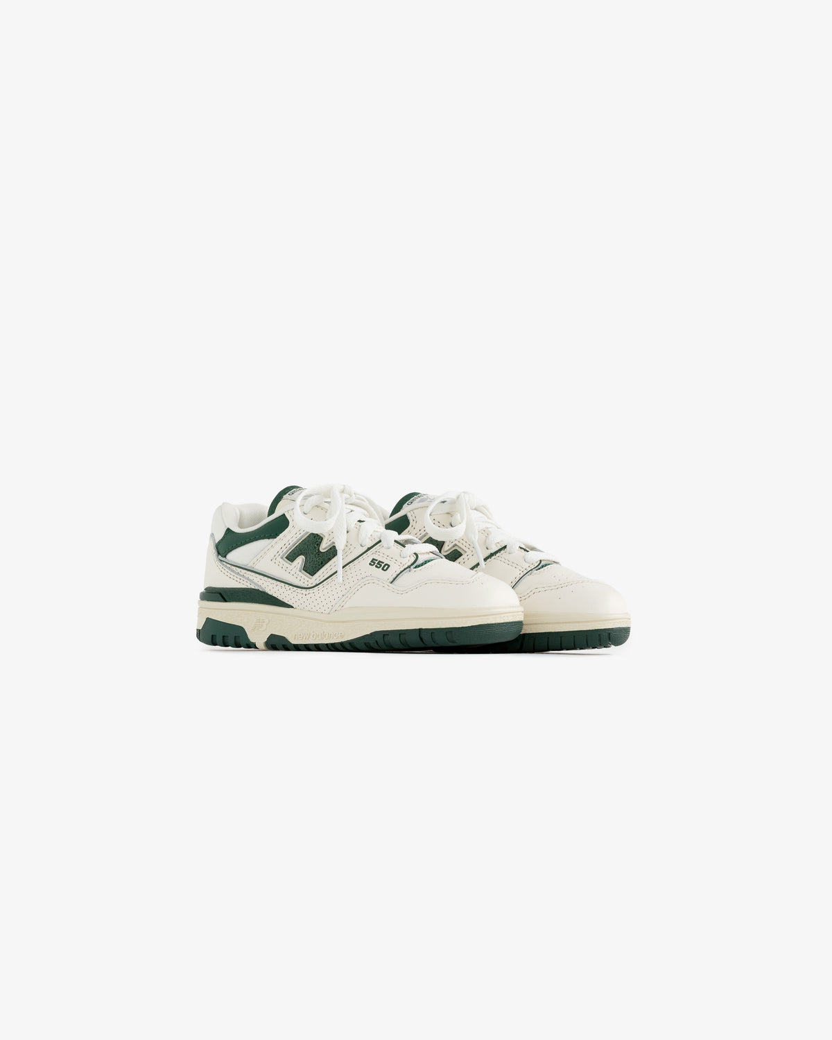 ALD / NB P550 Basketball Oxfords for little kids in white and green, laced, side by side on a white background.