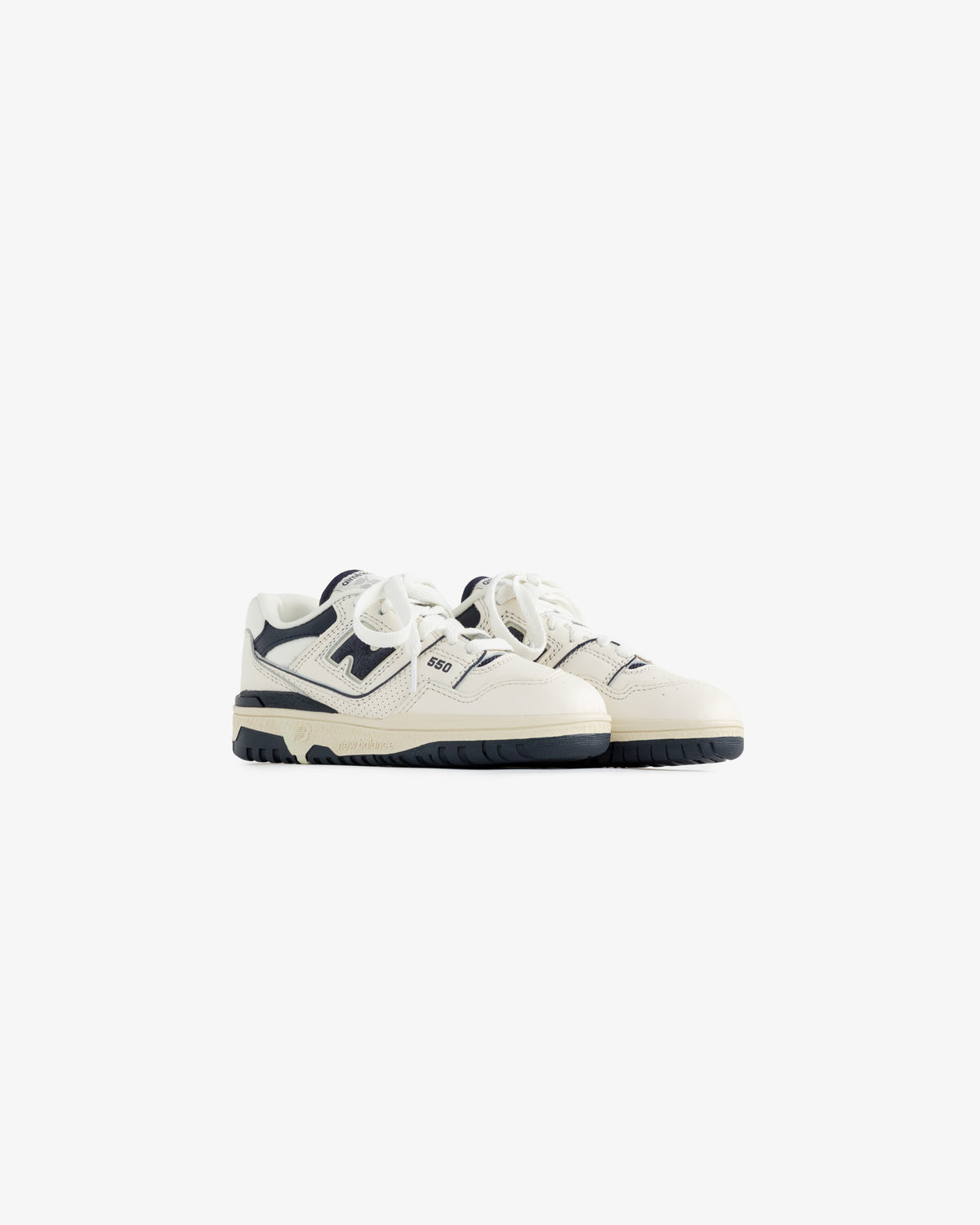 ALD / NB P550 Basketball Oxfords for little kids in white and navy with laces, shown on a plain white background.