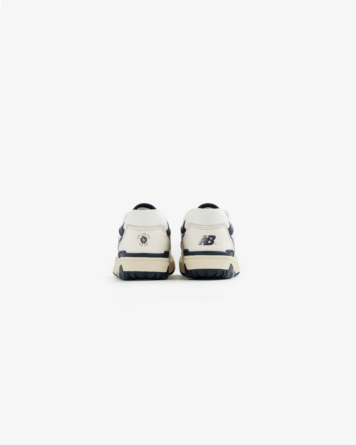 ALD / NB P550 Basketball Oxfords for little kids in white and navy, shown from the back on a plain white background.