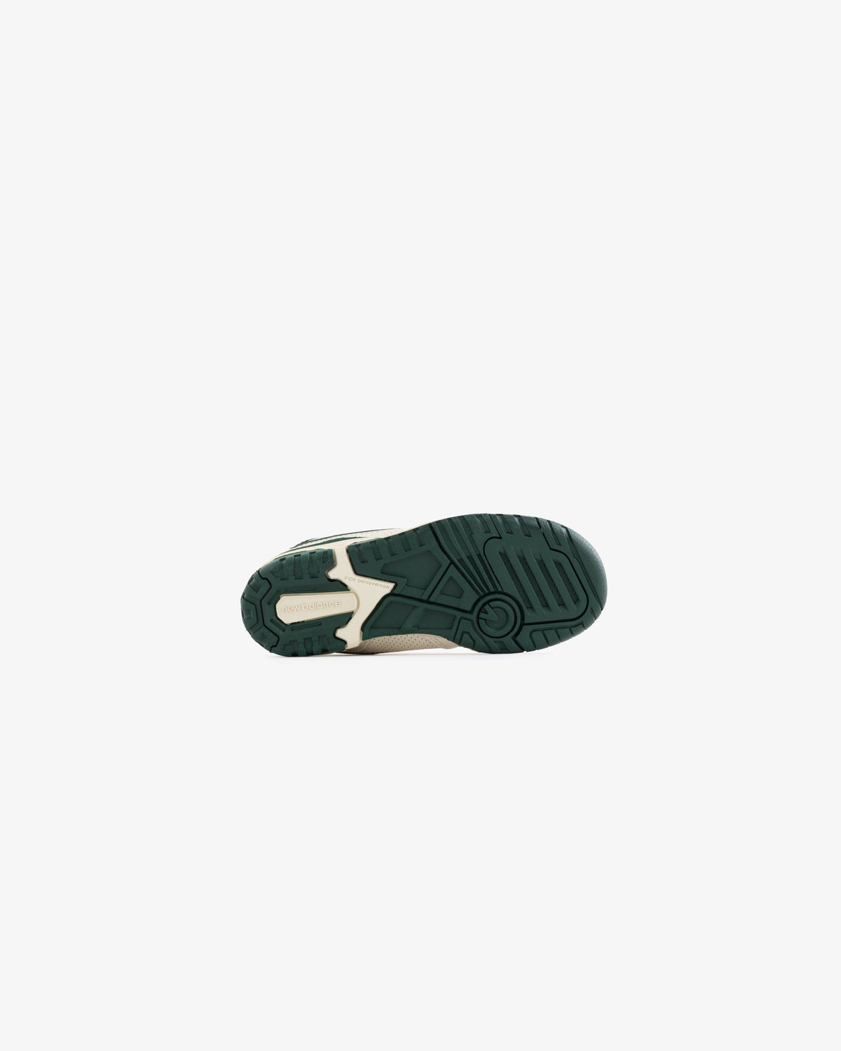 The image shows the green and beige sole of the ALD / NB P550 Basketball Oxfords - Little Kids against white.