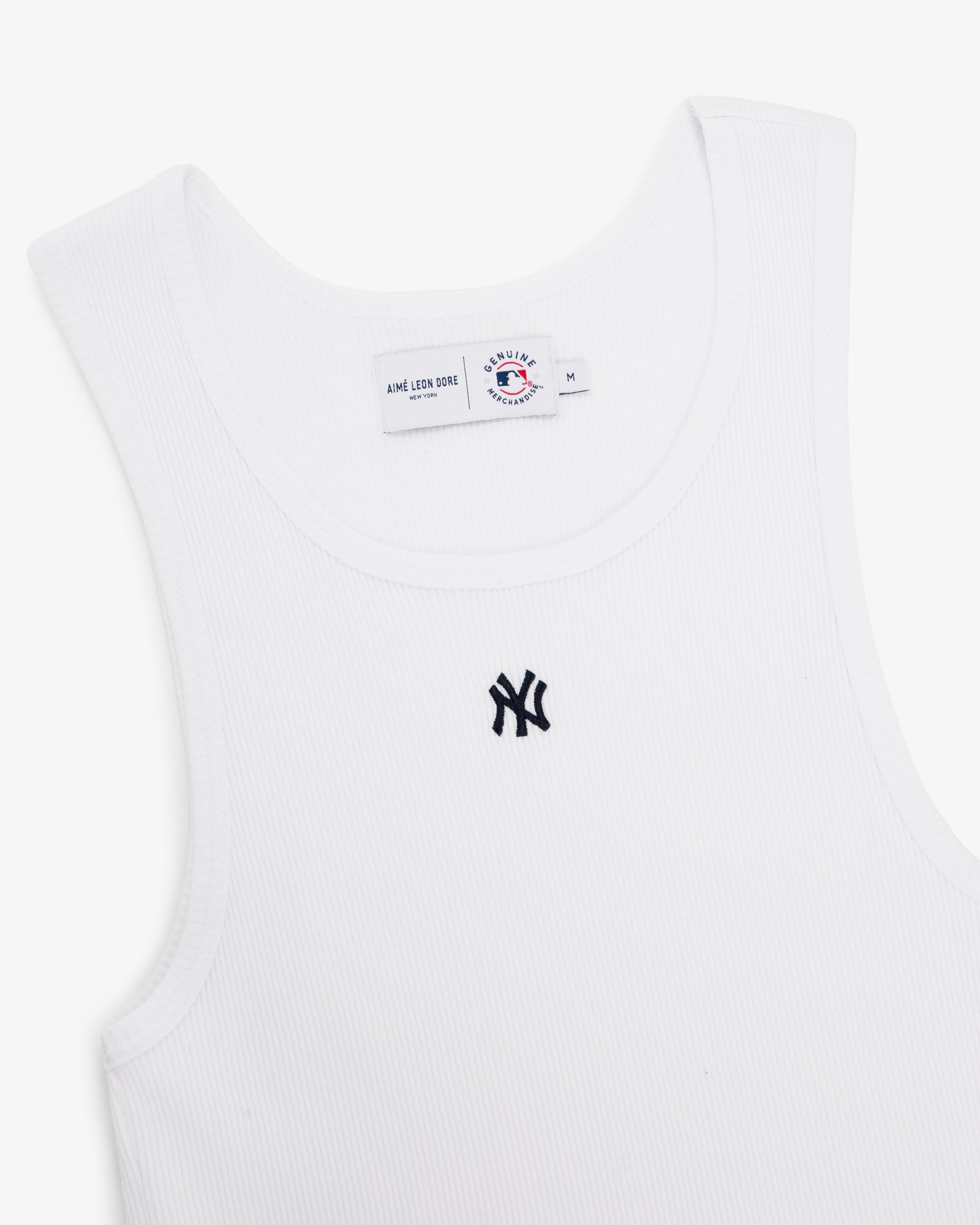 Yankees Tank Top: White ribbed tank with black New York Yankees logo on chest and visible collar tag.