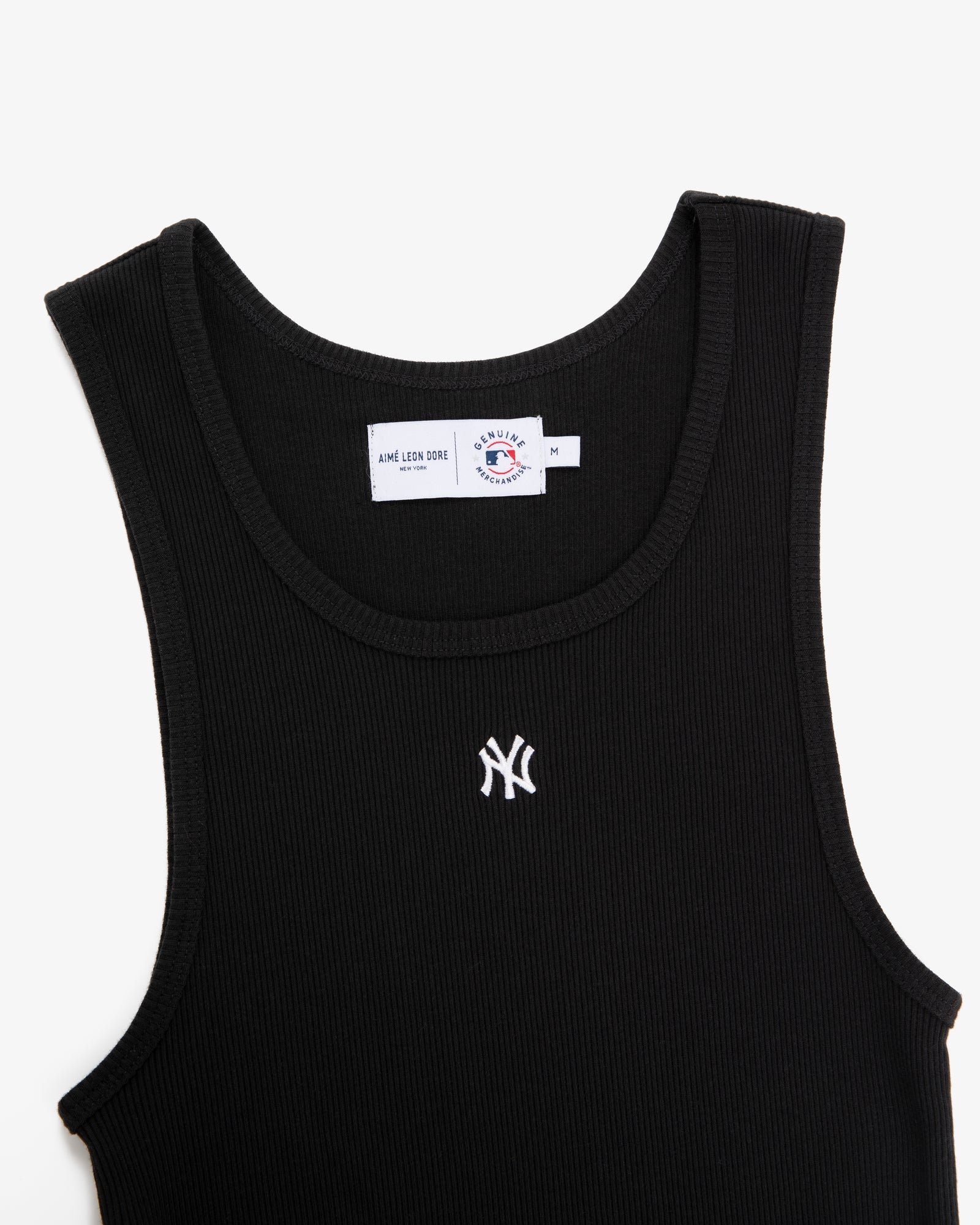 Yankees Tank Top: Black ribbed tank with a small white Yankees logo embroidered on the chest, shown on white.