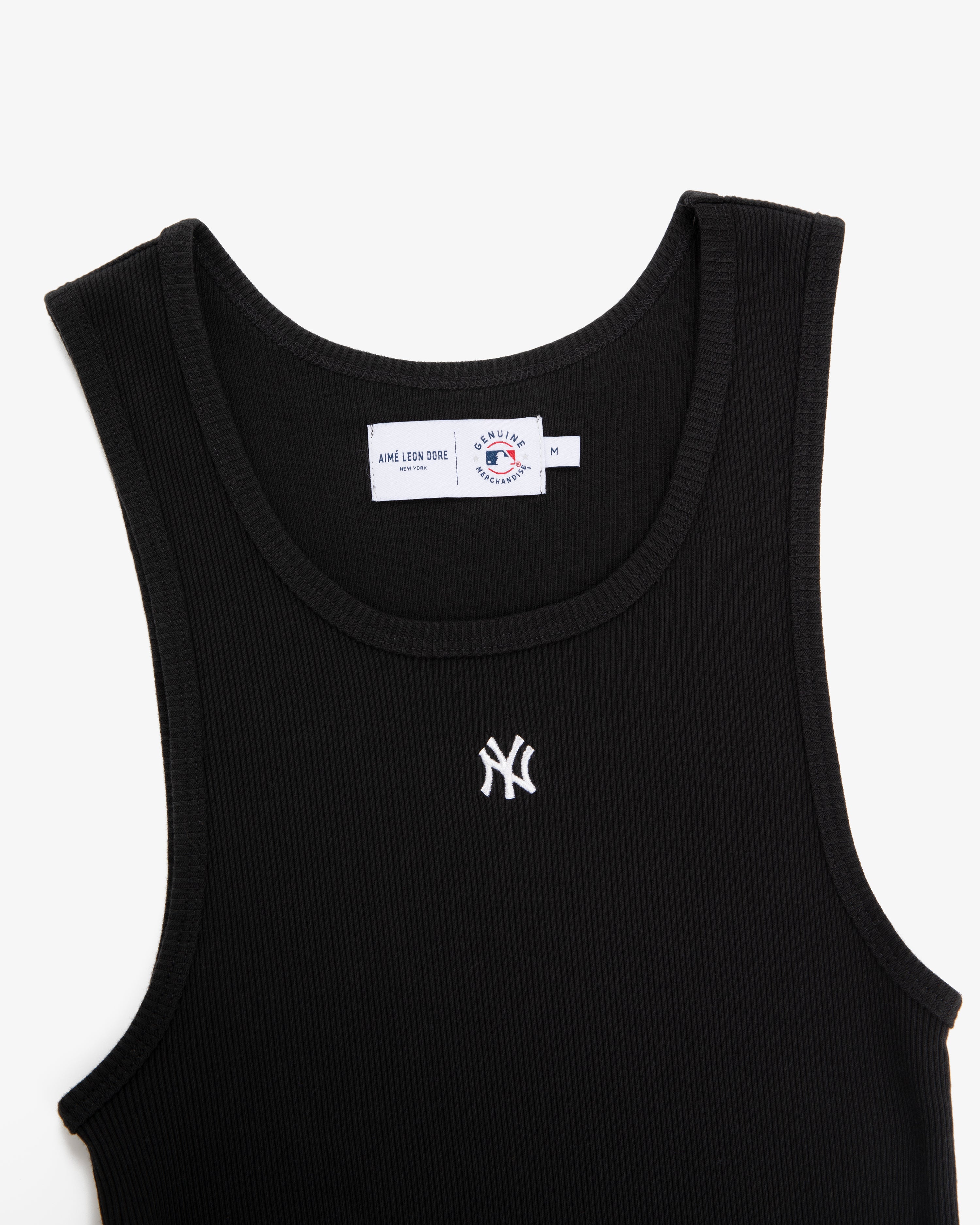 Yankees Tank Top: Black ribbed tank with a small white Yankees logo embroidered on the chest, shown on white.