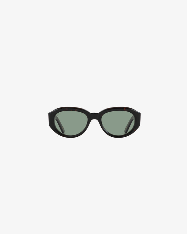 Jackie O Sunglasses: black oval frames with green tinted lenses, shown on a plain white background.