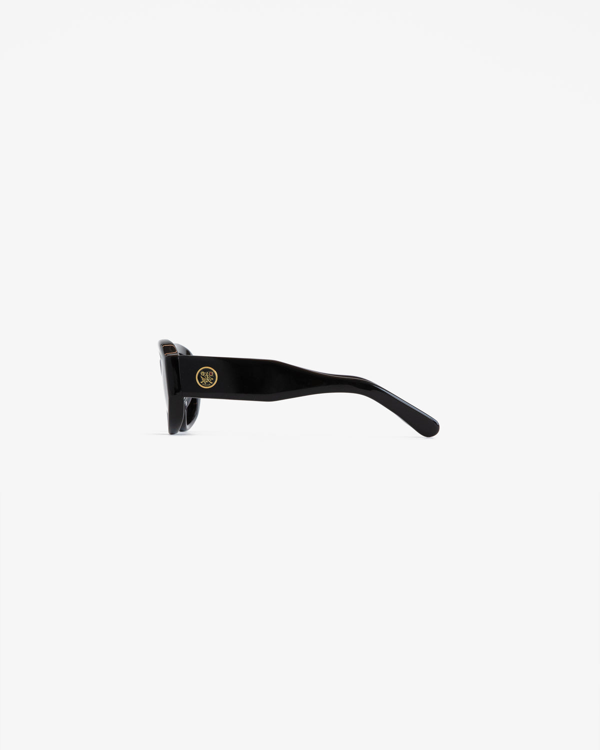 Jackie O Sunglasses shown from the side, with thick arms and a small gold logo by the hinge on a white background.
