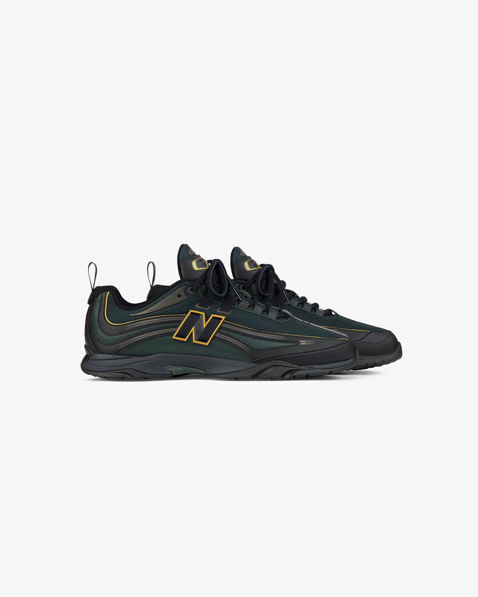 ALD / New Balance RC56 sneakers in black and green with yellow accents and N logos, shown on a white background.