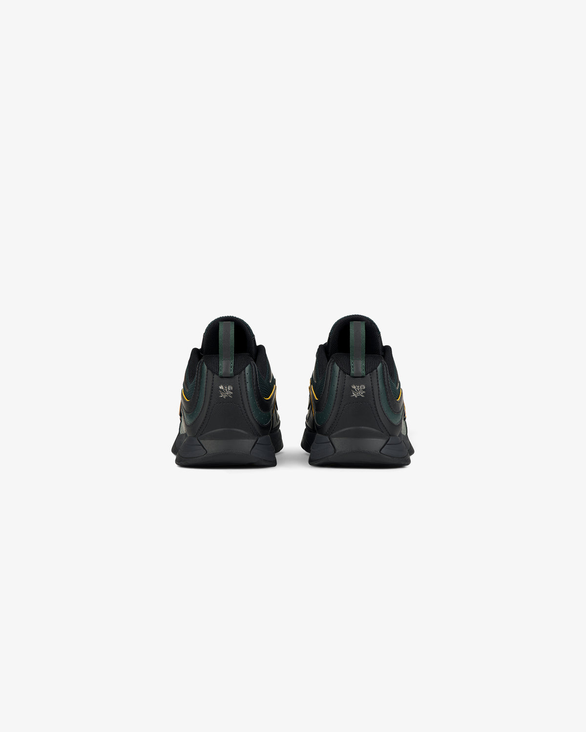 ALD / New Balance RC56 black sneakers with green and yellow accents, shown from the back on a white background.