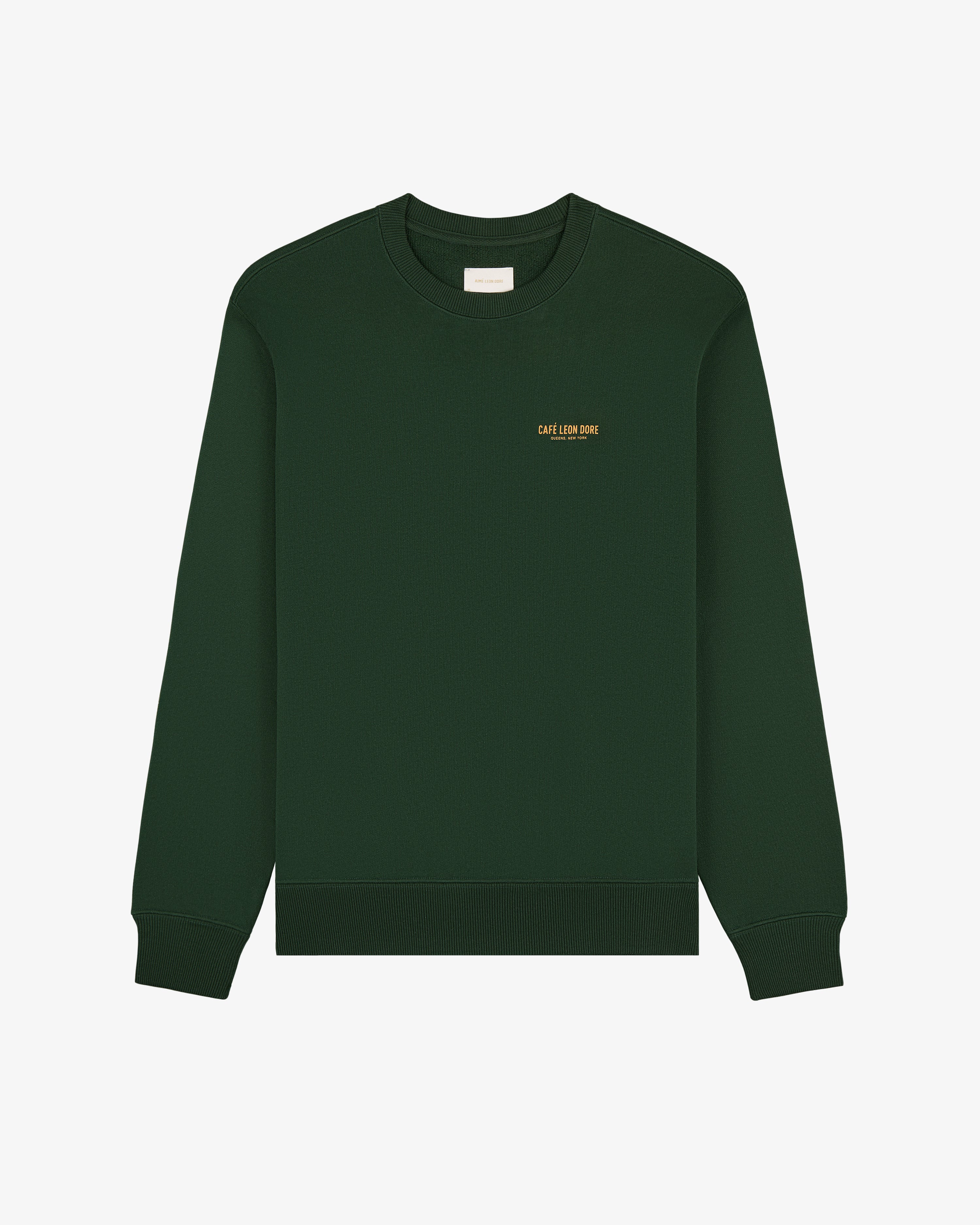 Café Leon Dore Crewneck Sweatshirt in dark green with small yellow chest text, shown on a white background.