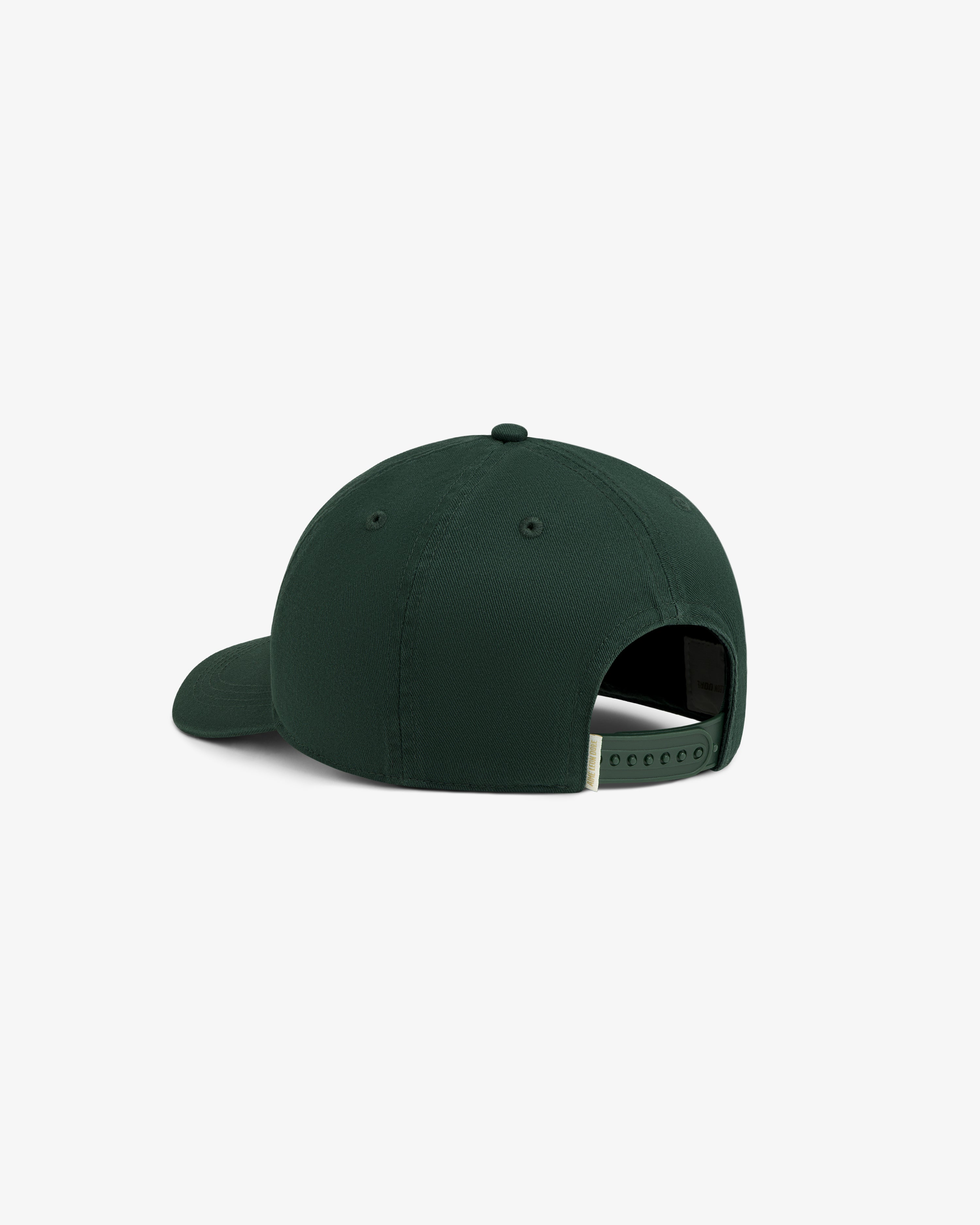 Café Leon Dore Logo Hat in dark green, shown from the back with adjustable strap and slightly curved brim.