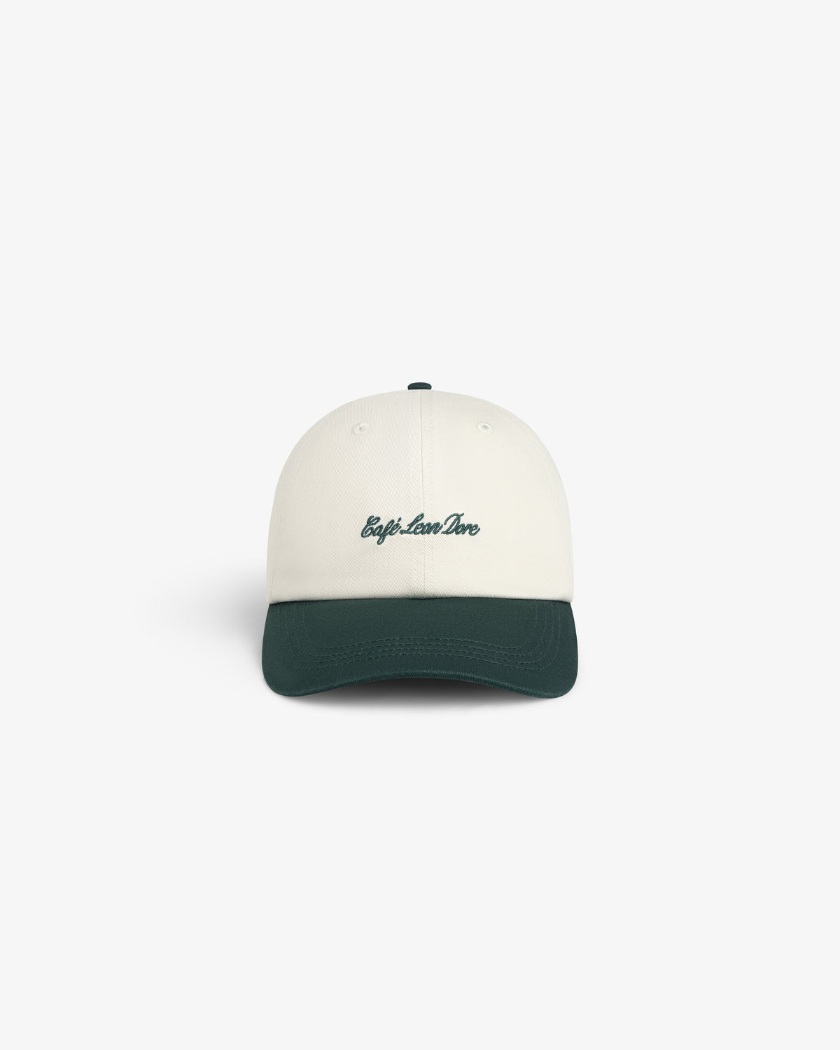 Café Leon Dore Script Hat: white cap with dark green brim, “trip.love.live” in green on front, white background.