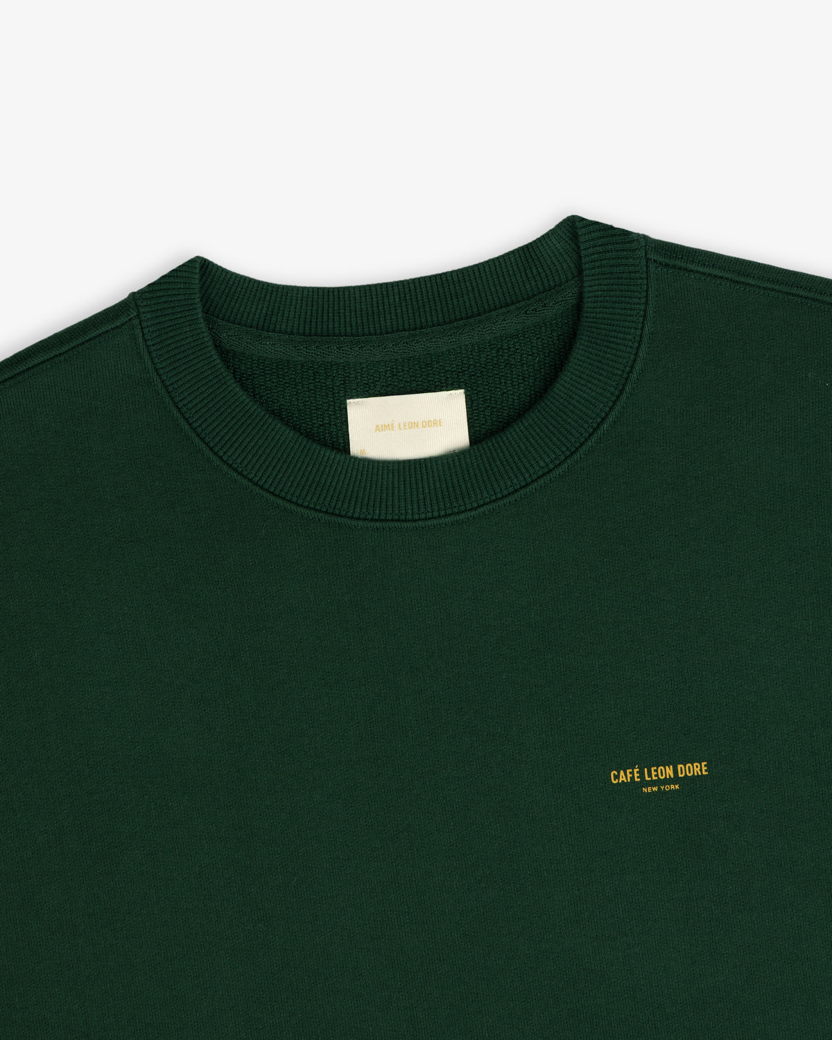 Dark green Café Leon Dore Crewneck Sweatshirt with yellow New York chest text.