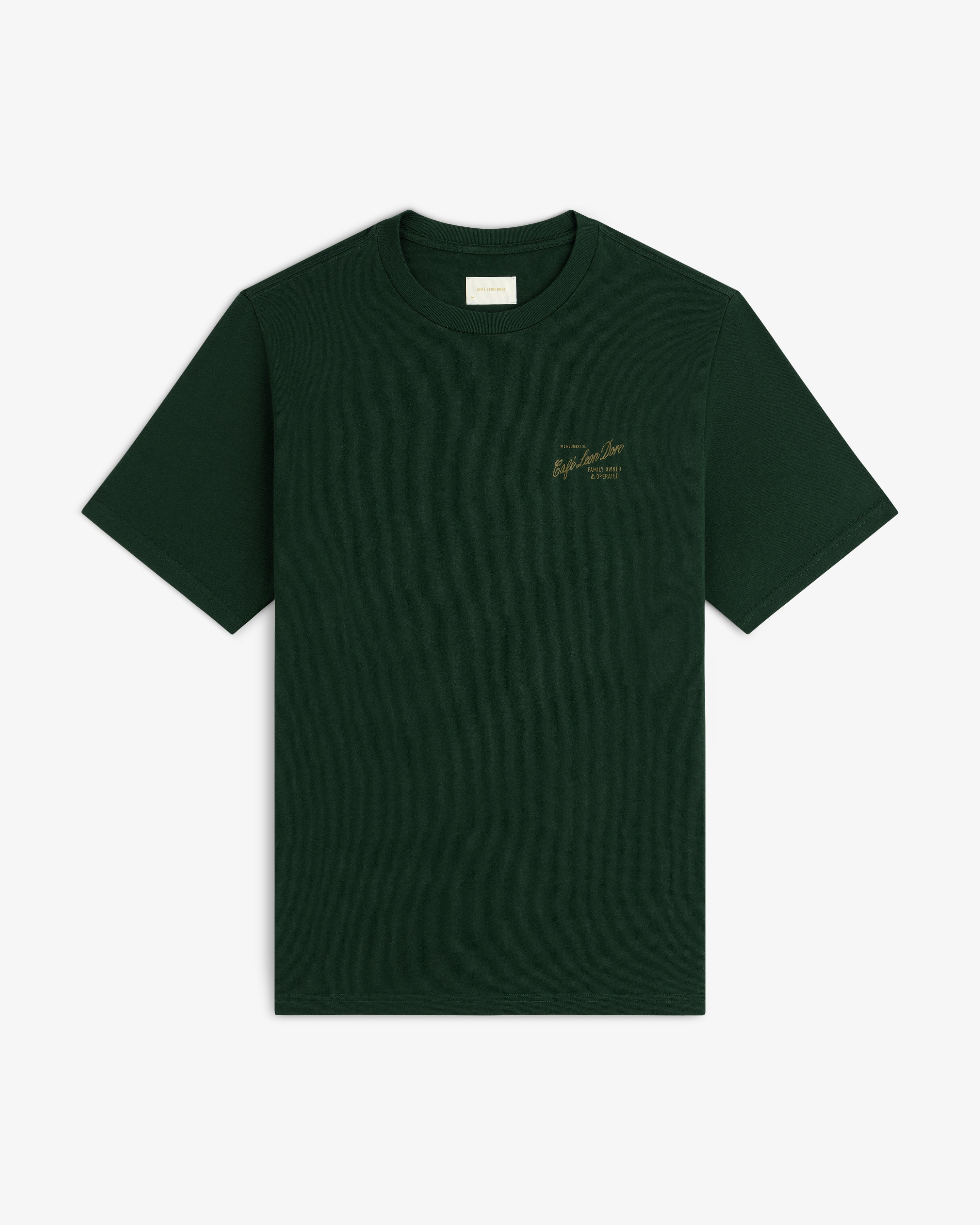 Café Leon Dore Mulberry Tee: dark green, short sleeves, small gold text on left chest, shown on white background.