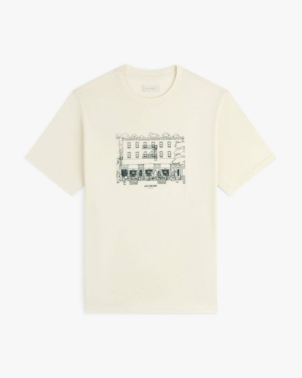 Café Leon Dore Storefront Tee: Off-white tee with black line art of a building and trees on the chest.