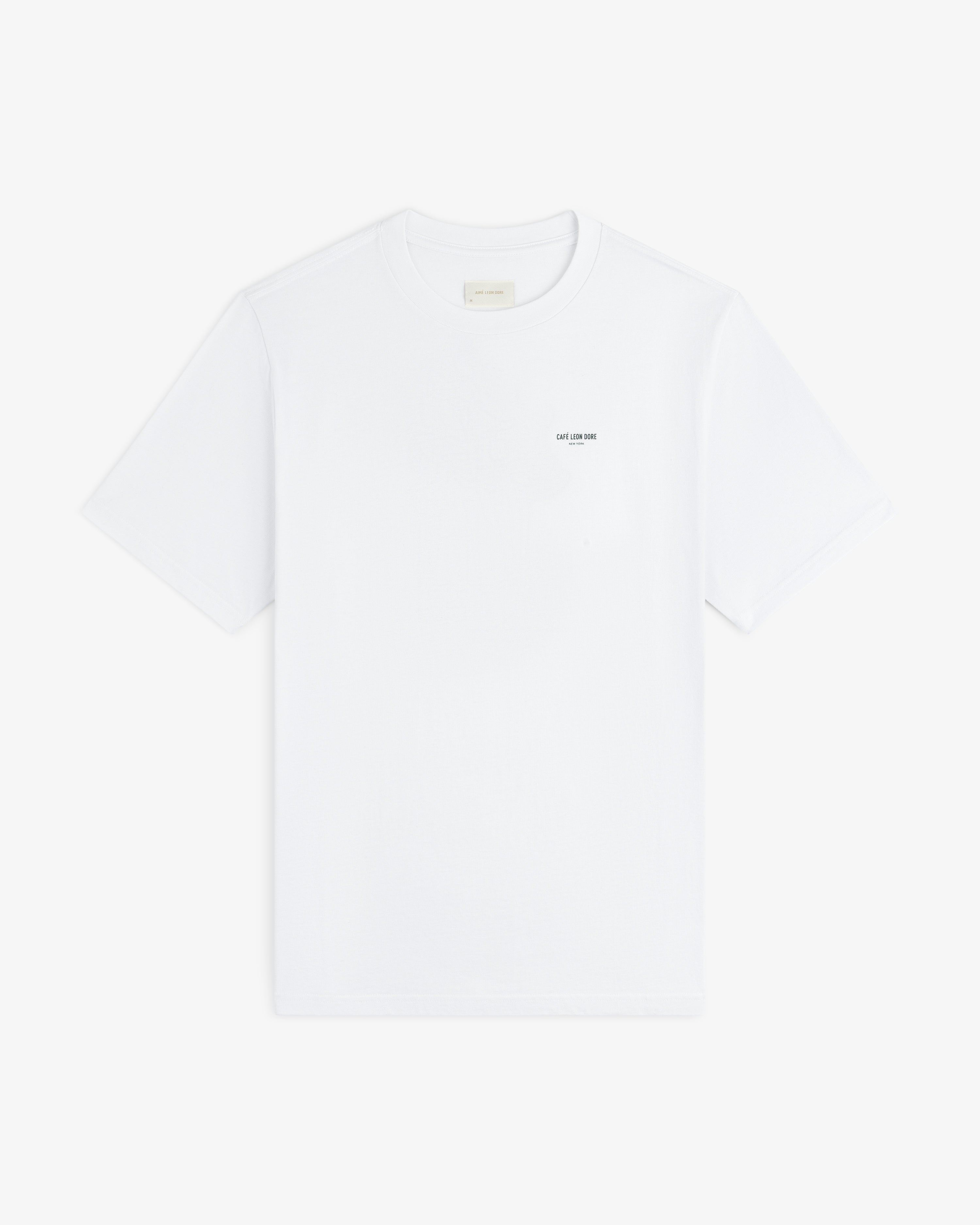 Café Leon Dore Caricature Tee: white short-sleeve shirt with small text on the left chest.