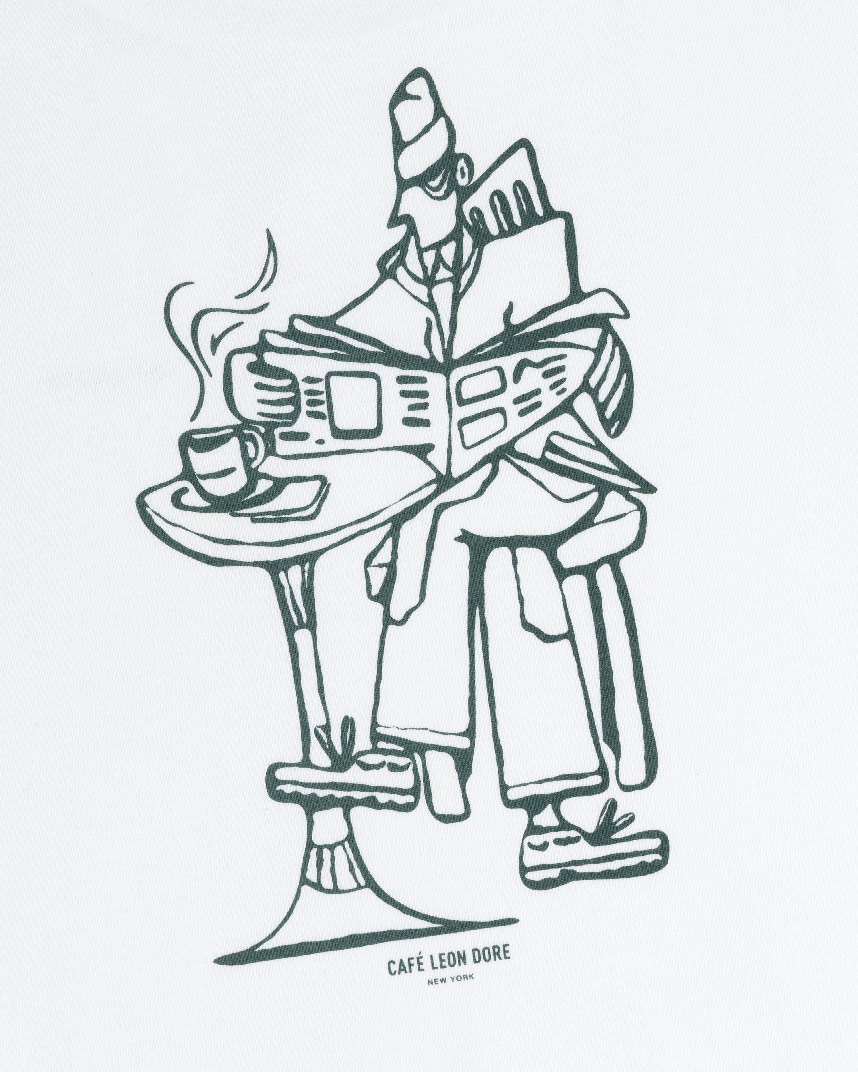 Line drawing on tee: person reads newspaper at table with coffee; text below says CAFÉ LEON DORE NEW YORK.