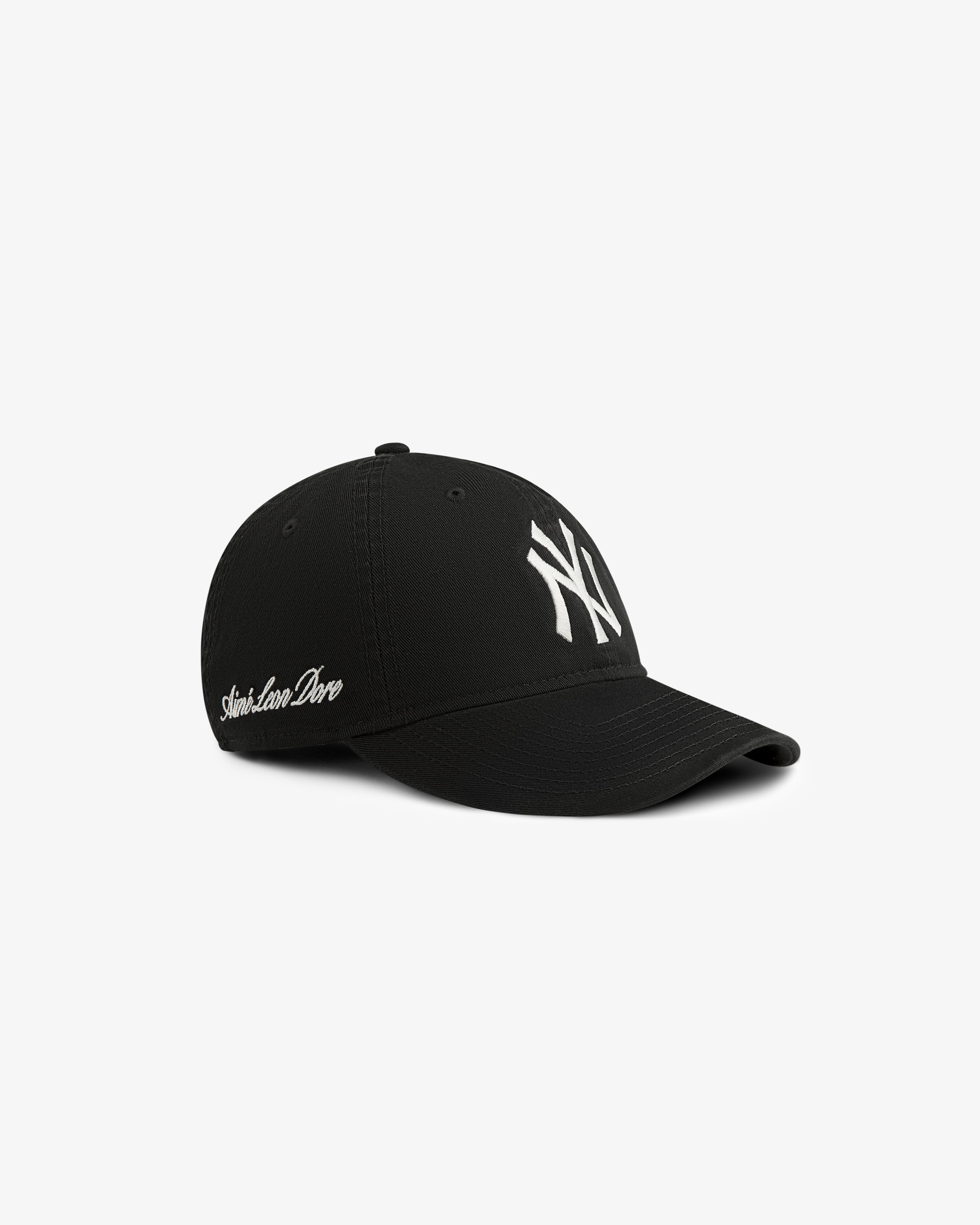 ALD/New Era Yankees Ballpark Hat in black with white NY logo and cursive text, shown on white background.