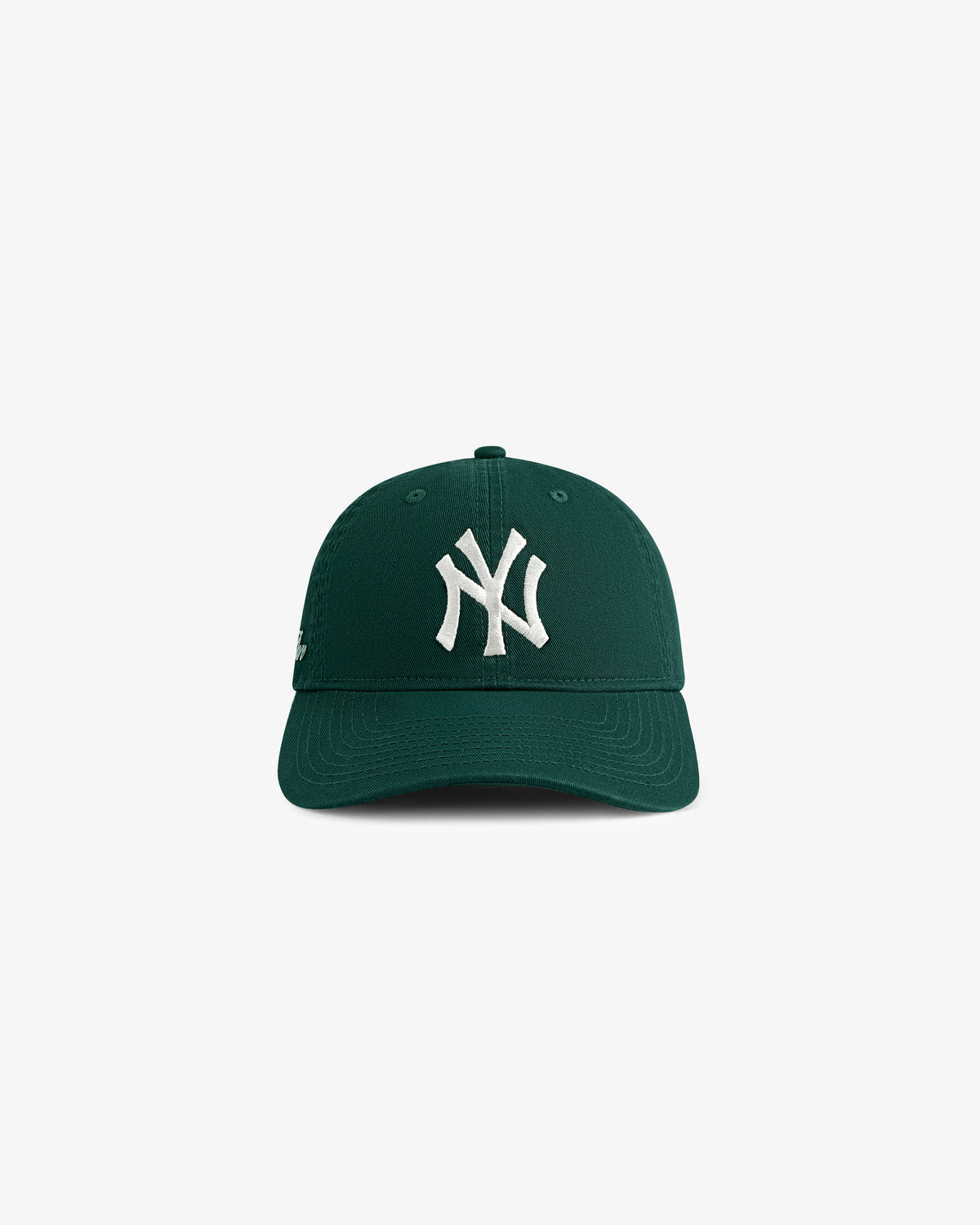ALD / New Era Yankees Ballpark Hat in dark green with white NY logo, front view on plain white background.