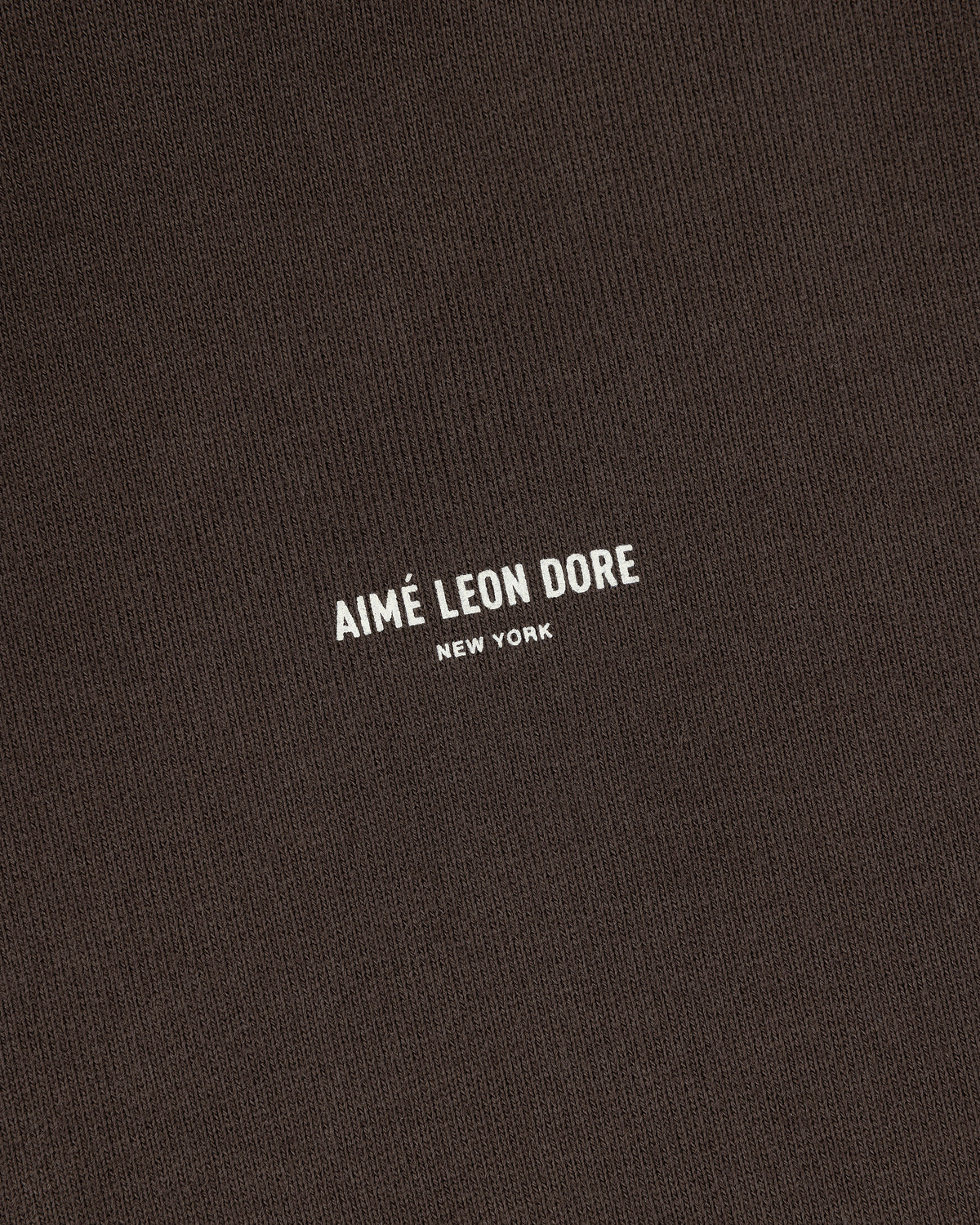 Brown Micro Logo Hoodie with AIMÉ LEON DORE NEW YORK in small white capital letters centered on the front.