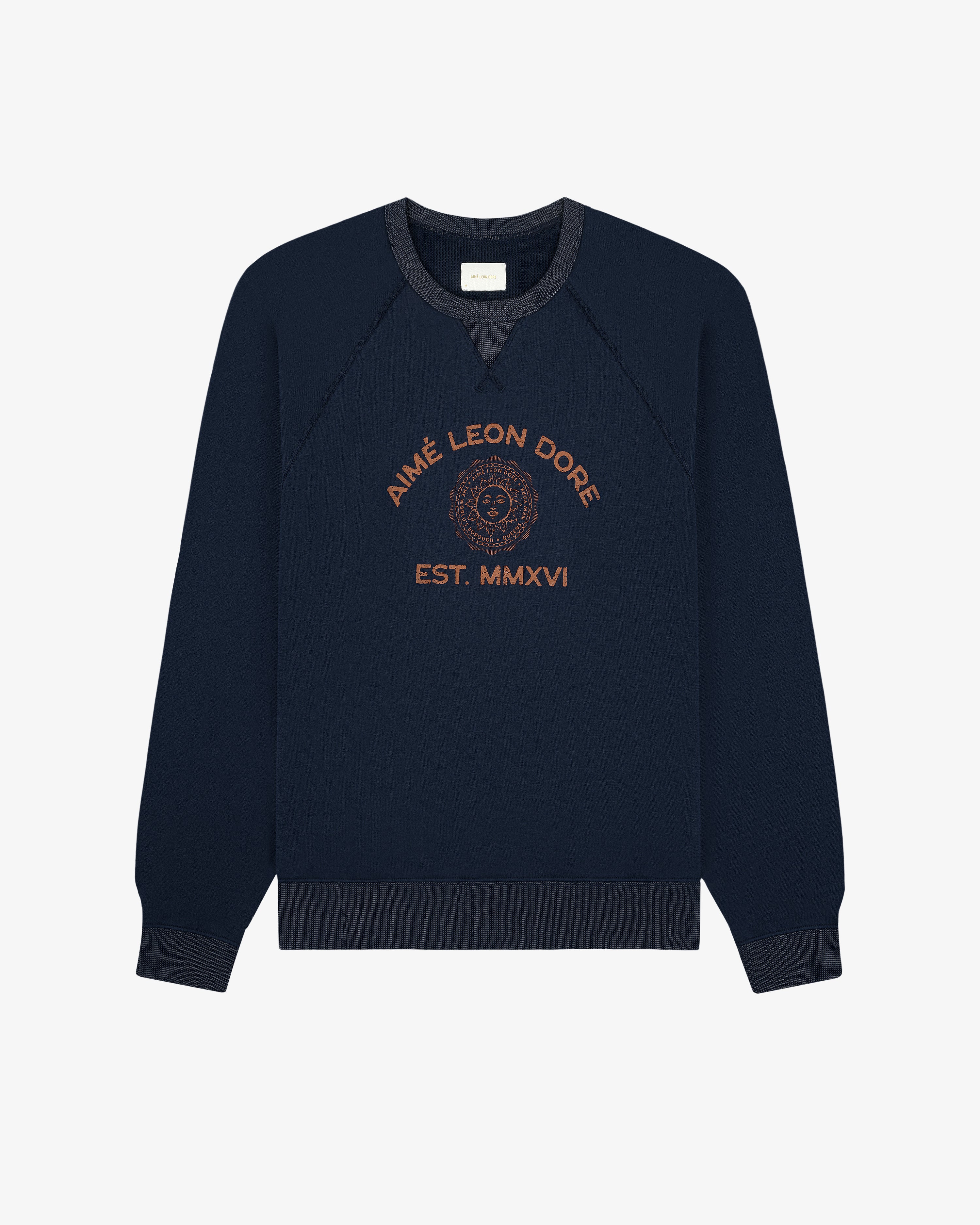 Souvenir Crewneck Sweatshirt in navy with gold AIMÉ LEON DORE EST. MMXVI and crest on front.