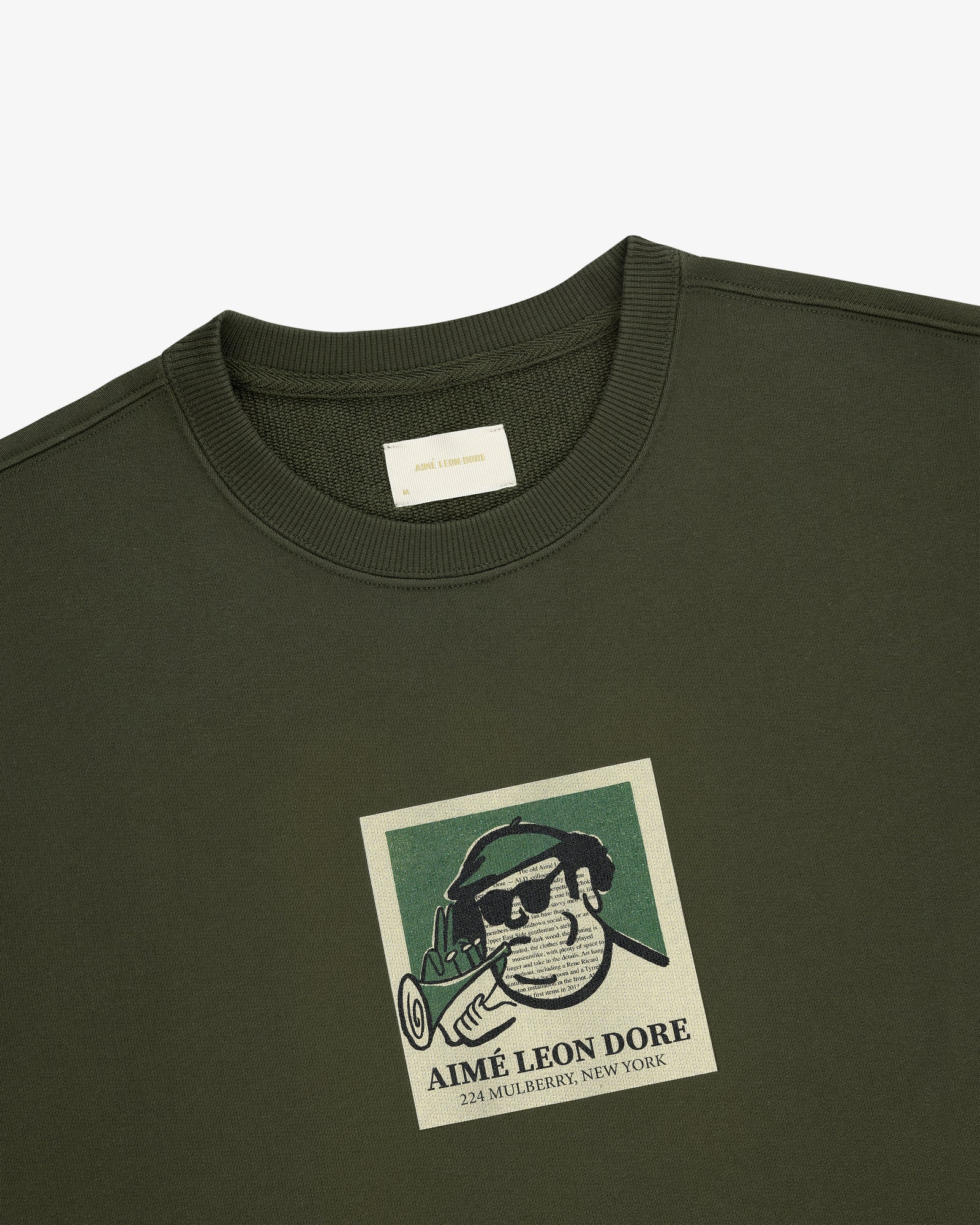 Musician Crewneck Sweatshirt with a graphic man in sunglasses, hat, brand name, and 224 Mulberry, New York.