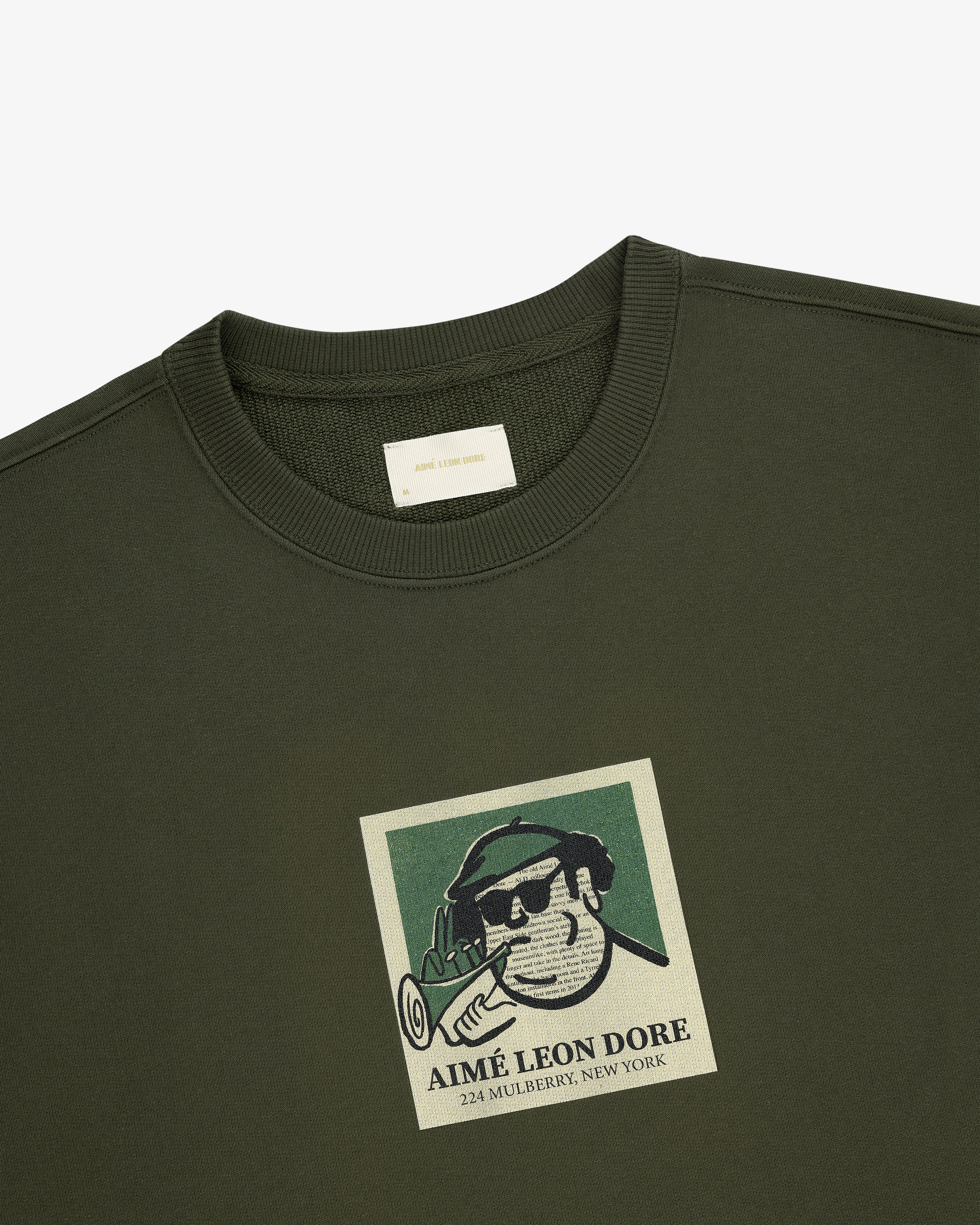 Musician Crewneck Sweatshirt with a graphic man in sunglasses, hat, brand name, and 224 Mulberry, New York.