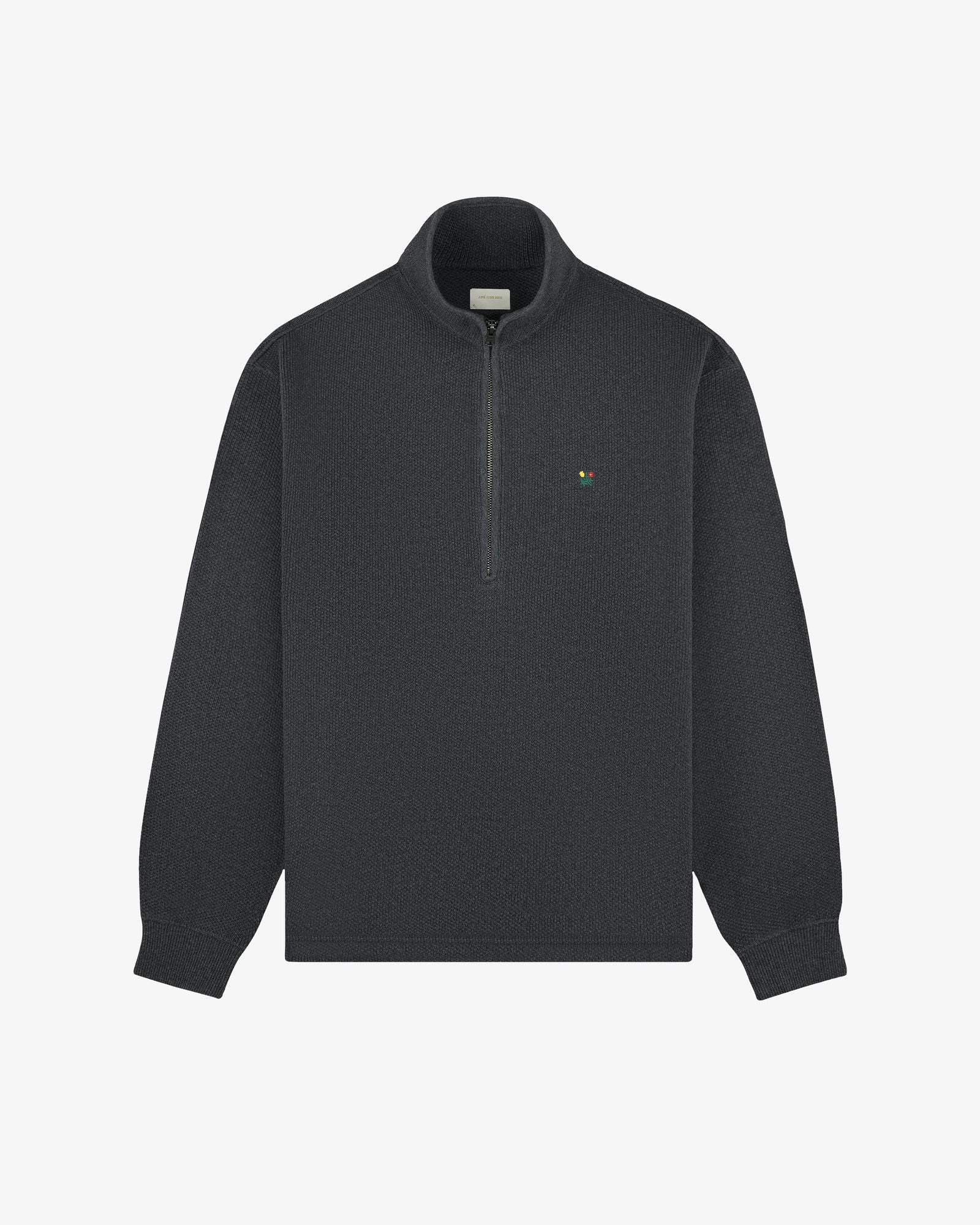 Crest Piqué Half-Zip Pullover in dark gray with a small left chest logo, shown on a plain white background.
