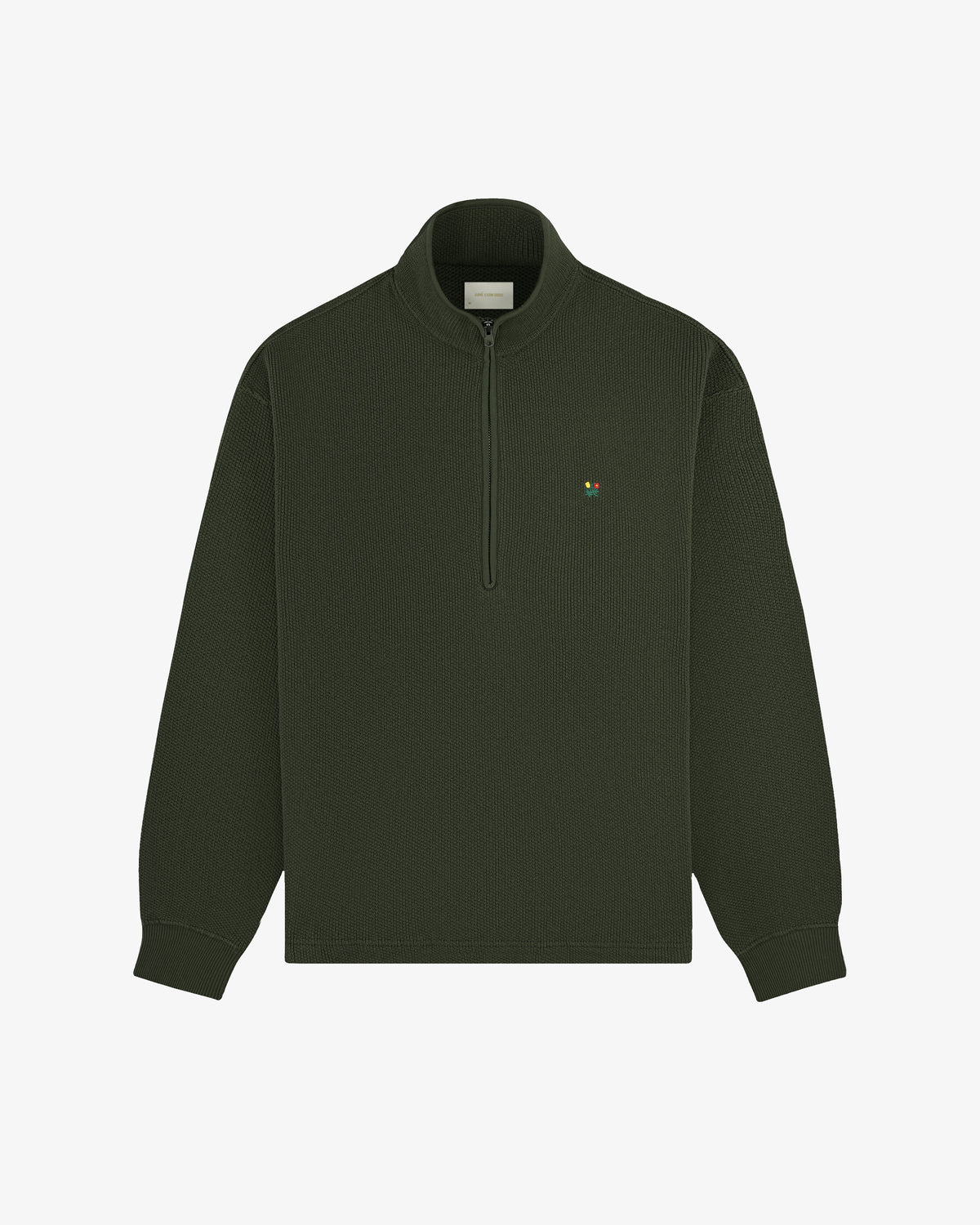 Crest Piqué Half-Zip Pullover in dark green with long sleeves and a small embroidered chest logo.