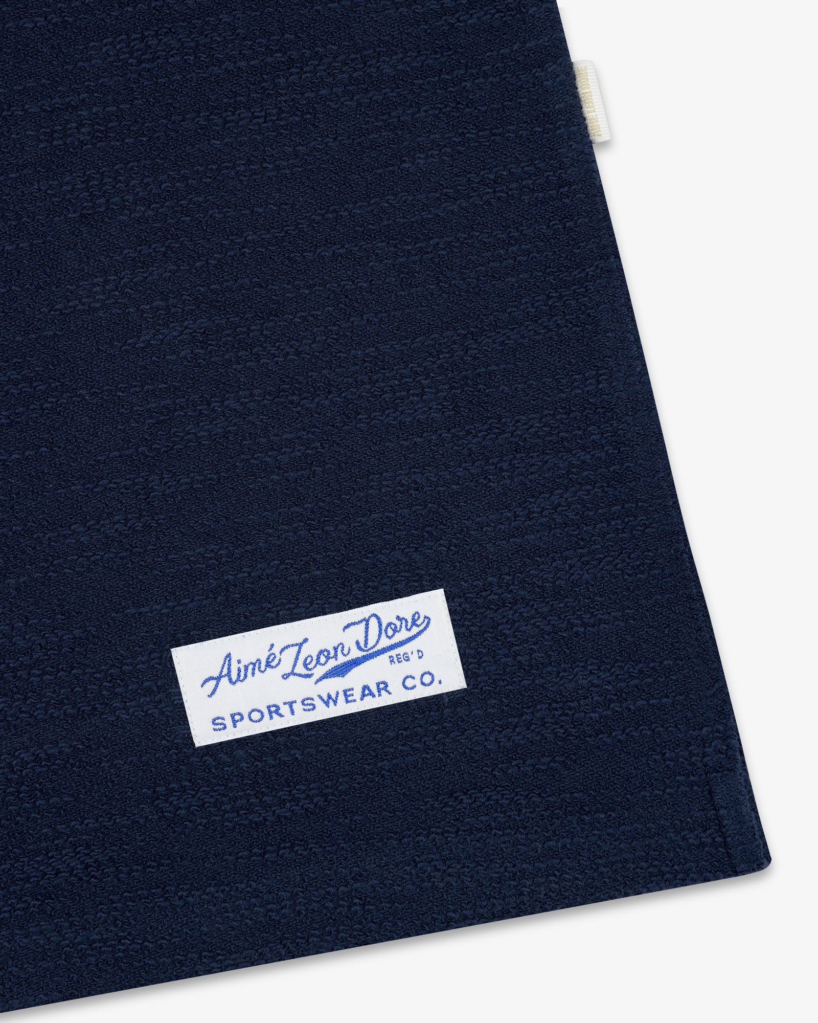 Navy blue Legacy Slub Football Jersey with a white Aimé Leon Dore SPORTSWEAR CO. label in the bottom left.