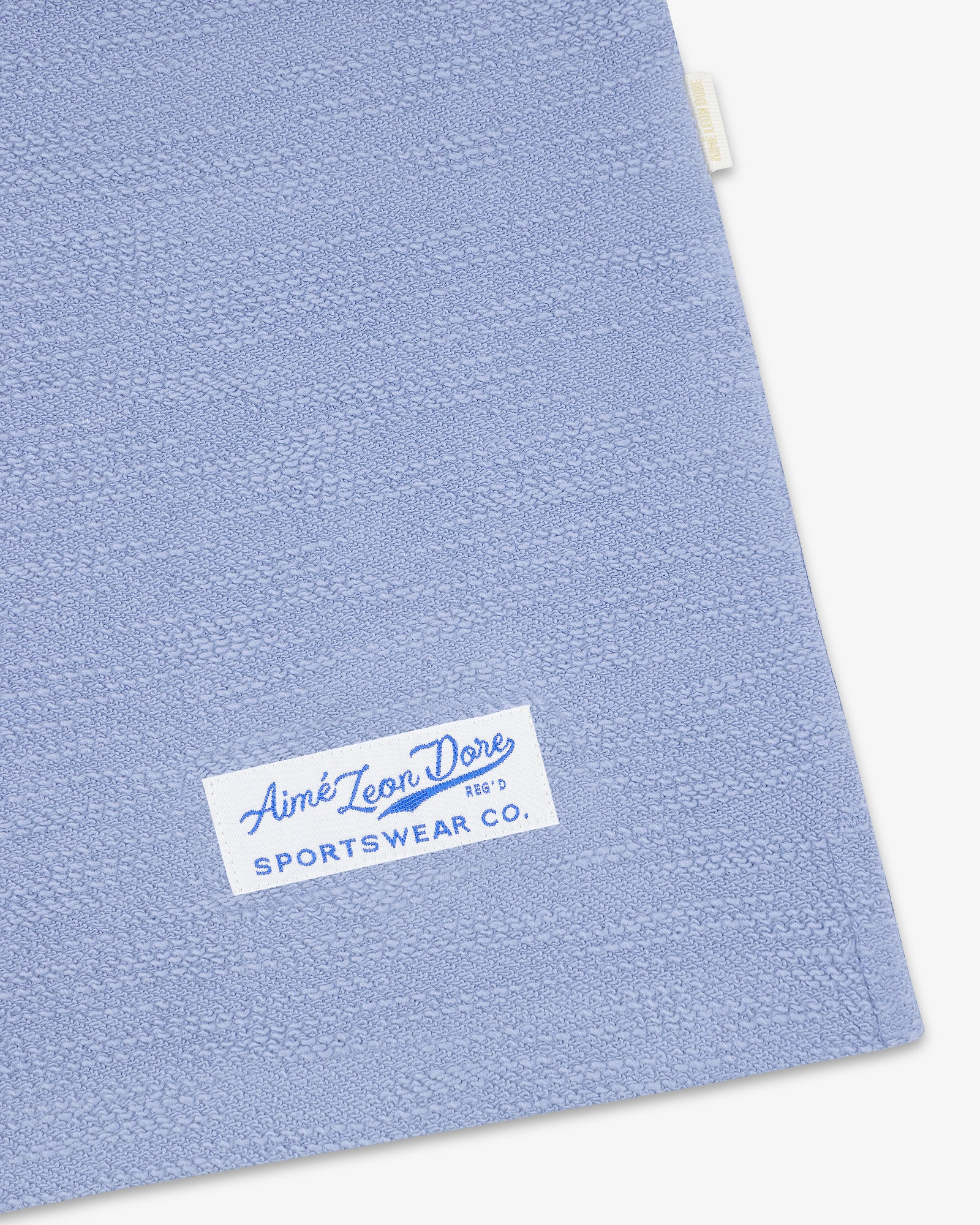 Light blue Legacy Slub Football Jersey with a white Aimé Leon Dore Sportswear Co. label sewn on the corner.