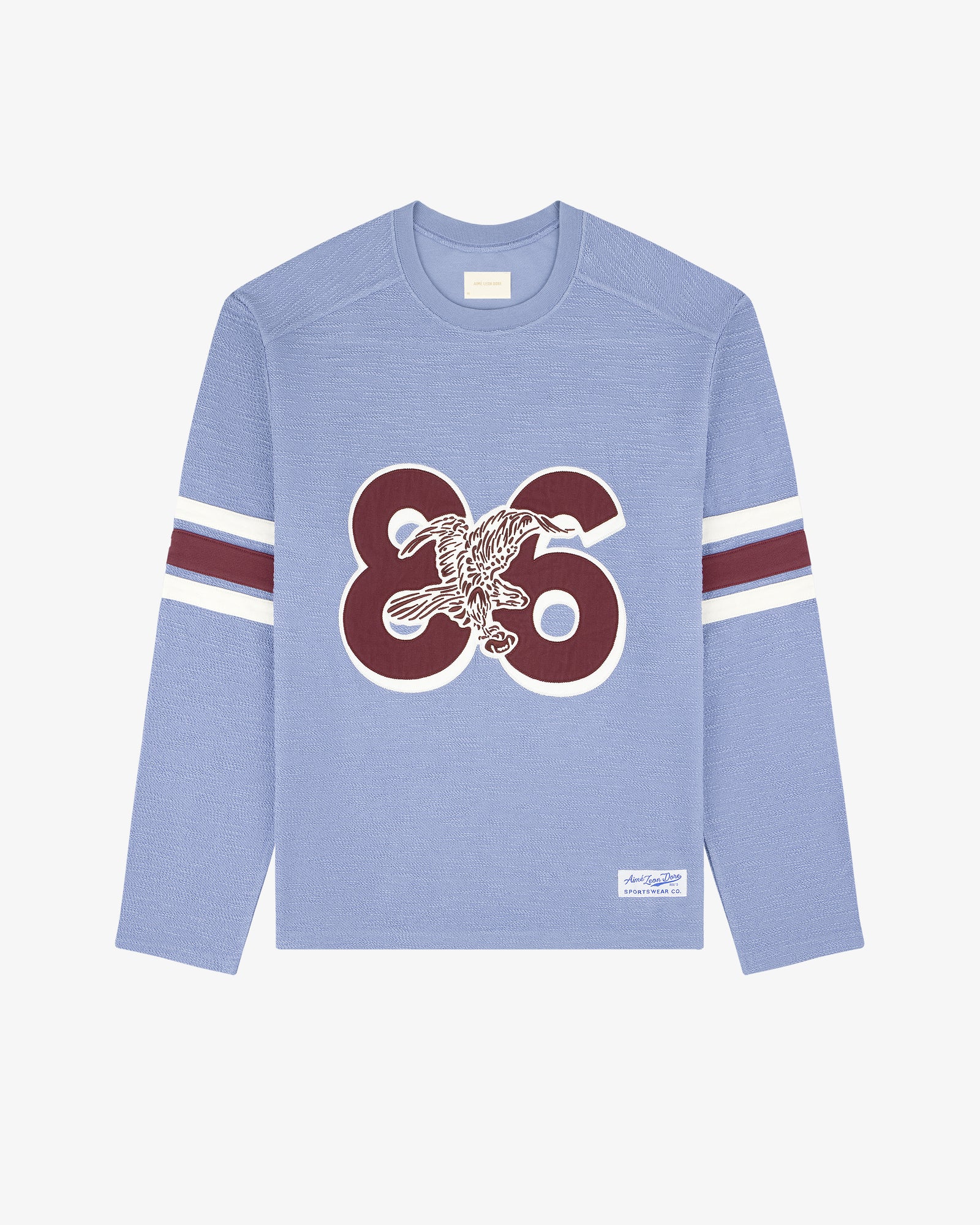 Legacy Slub Football Jersey: Light blue, long sleeves, 86 & eagle front, white/maroon sleeve stripes.
