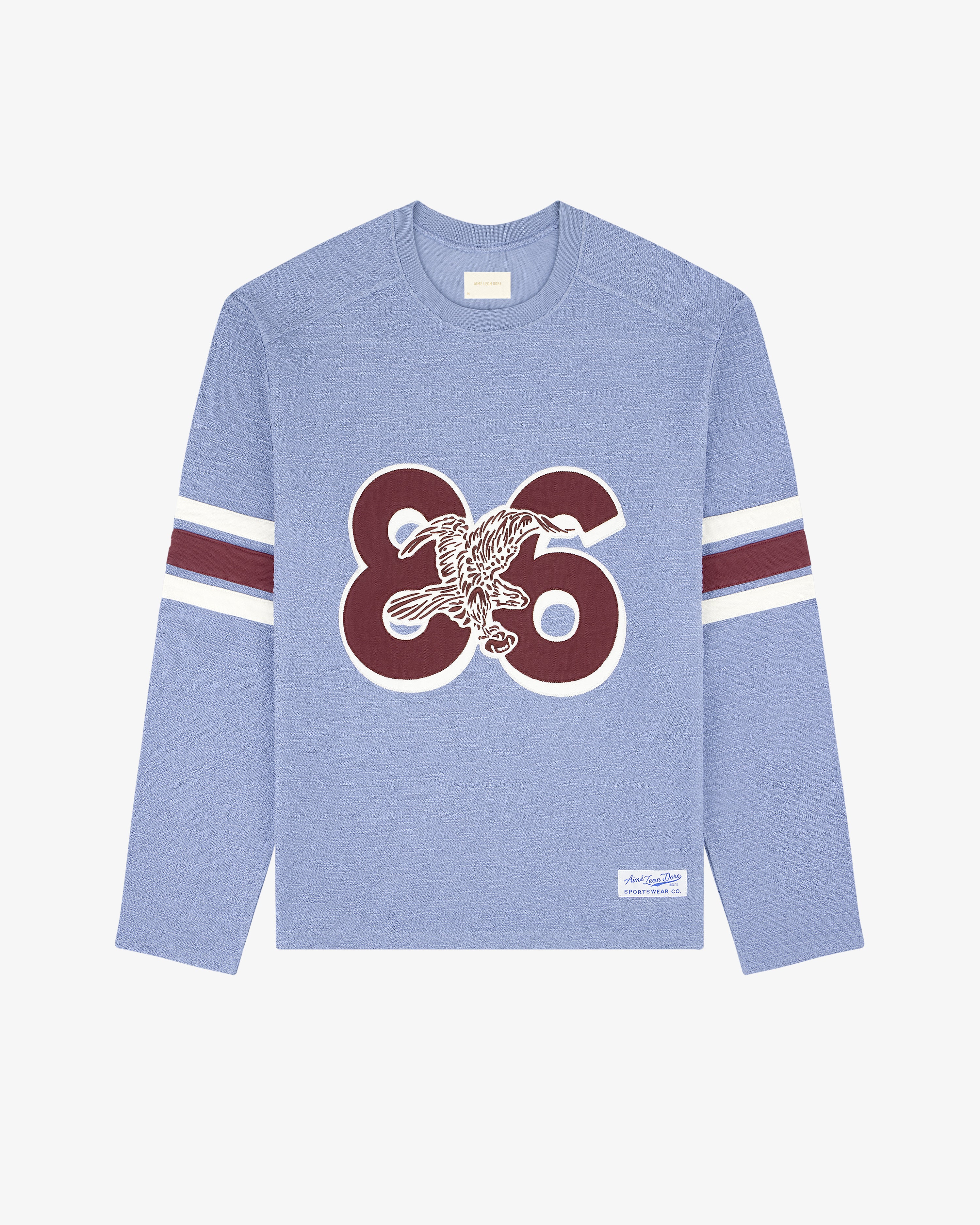 Legacy Slub Football Jersey: Light blue, long sleeves, 86 & eagle front, white/maroon sleeve stripes.