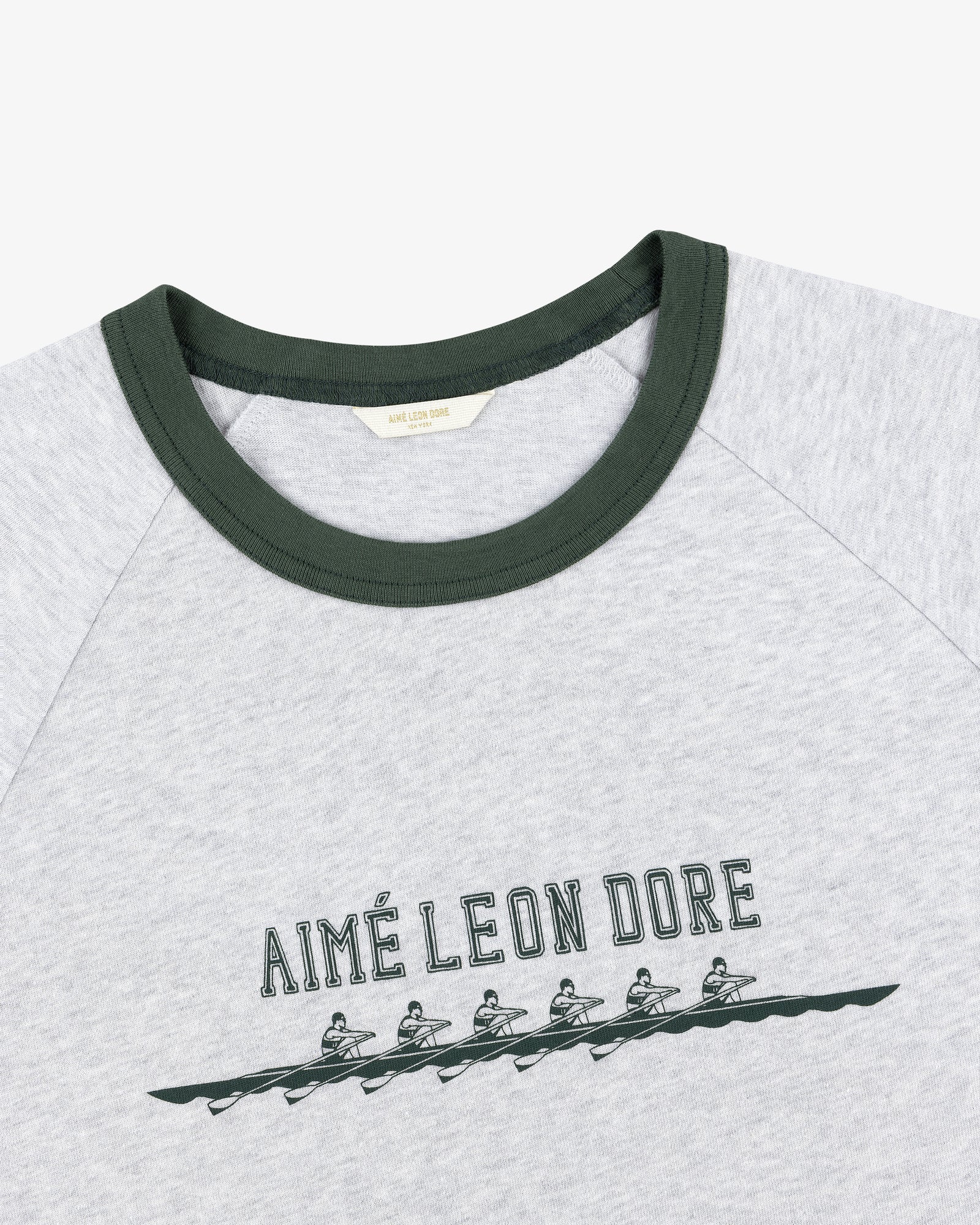 Rowing Tee: Grey shirt with green collar, AIMÉ LEON DORE text, and five rowers graphic below the text.