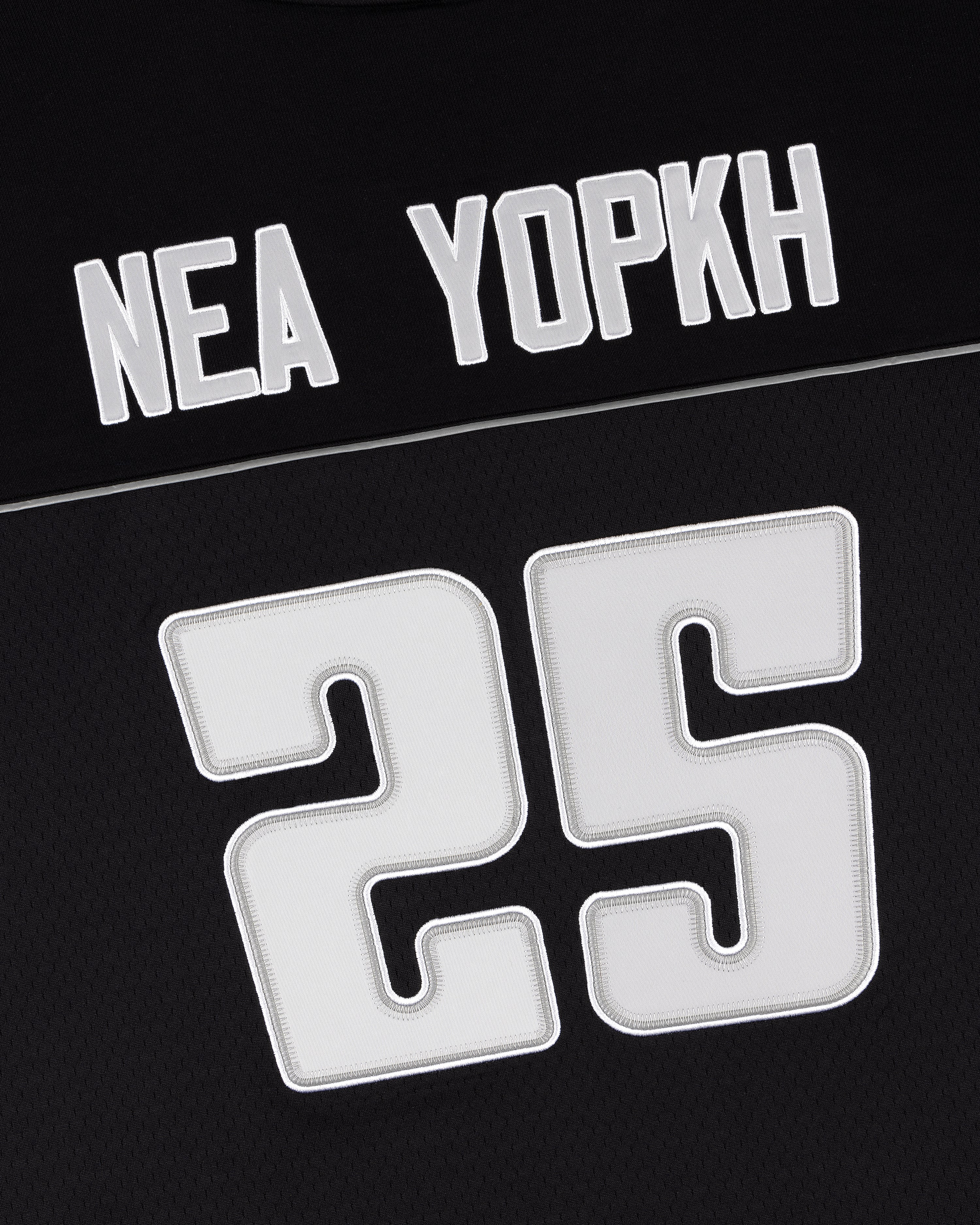 ALD / Mitchell & Ness Football Jersey: Black with “NEA YOPKH” and large white number 25 below.
