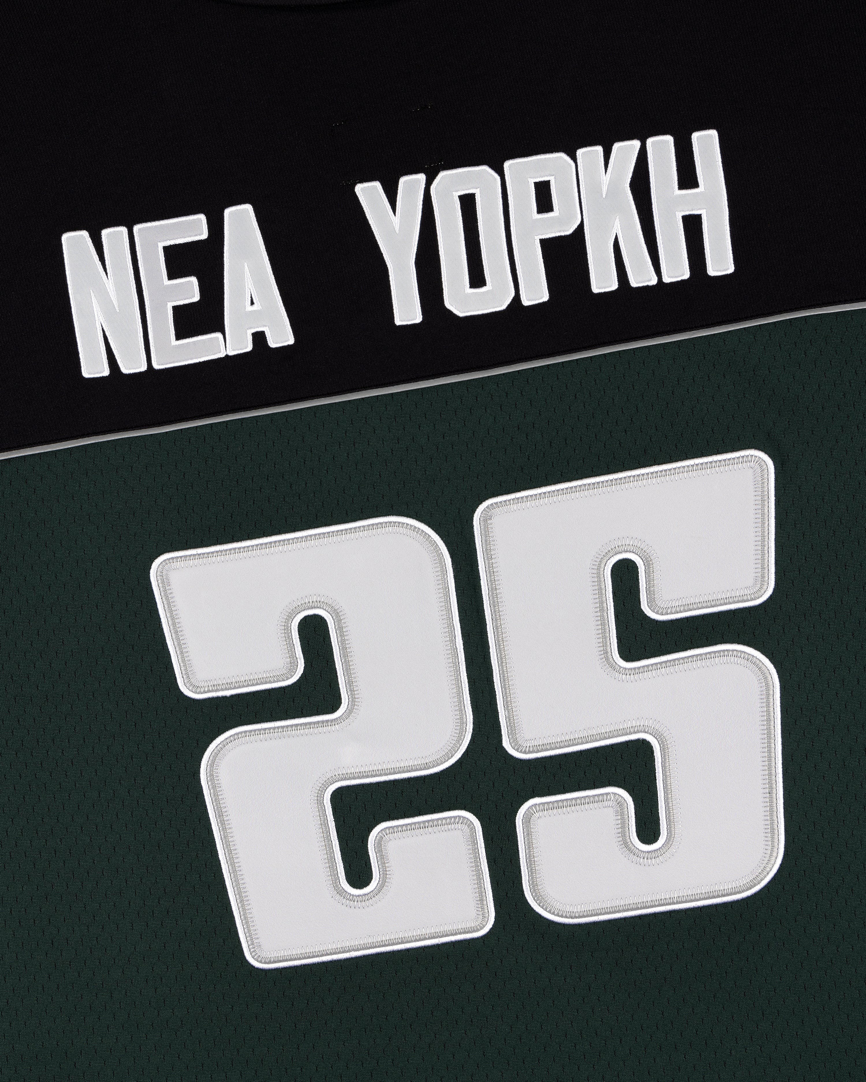 ALD / Mitchell & Ness black and green jersey with “NEA YOPKH” and a bold number 25 on the front.