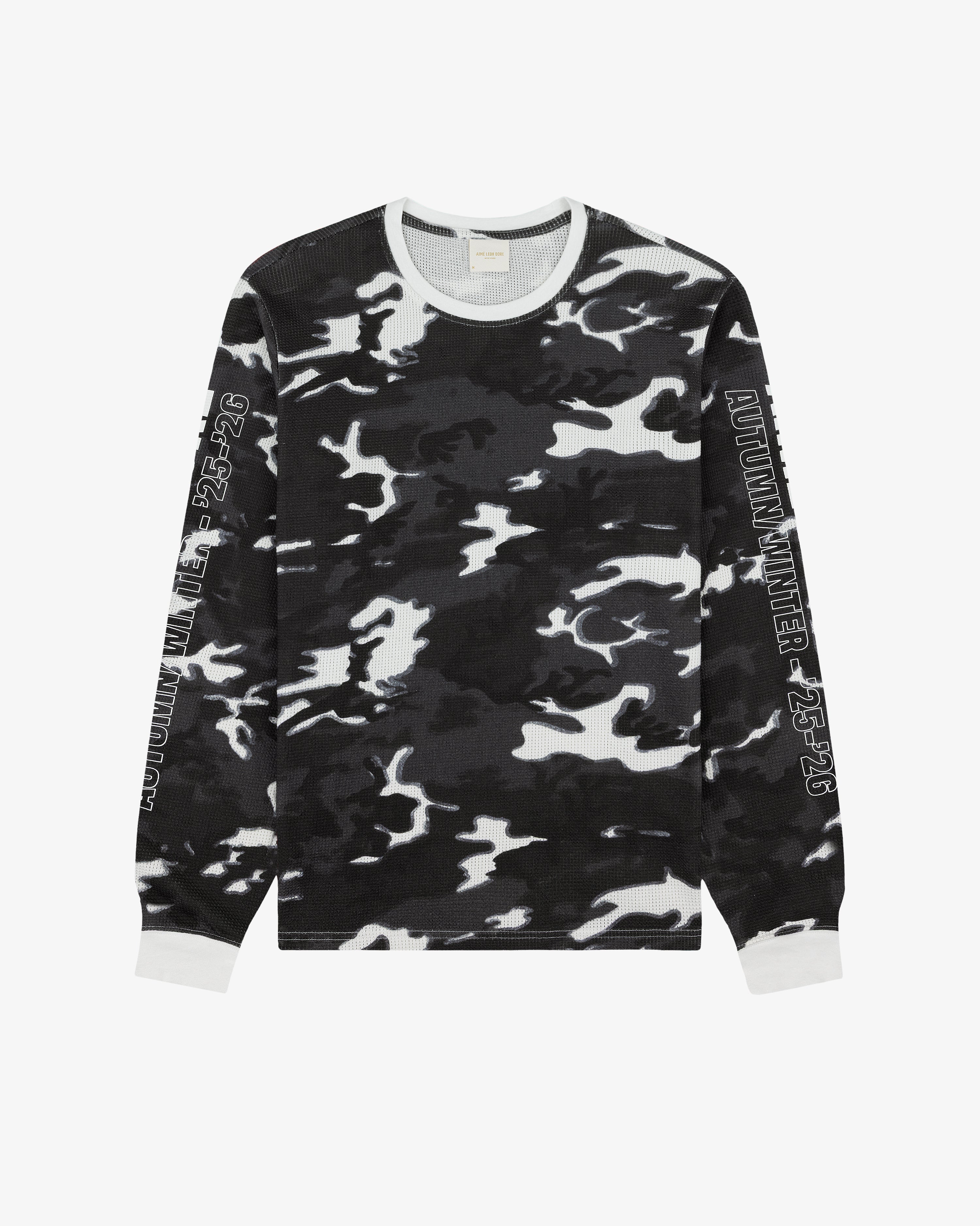 Printed Mesh Moto Tee with black, white & gray camo, sleeve text, and white cuffs & collar.