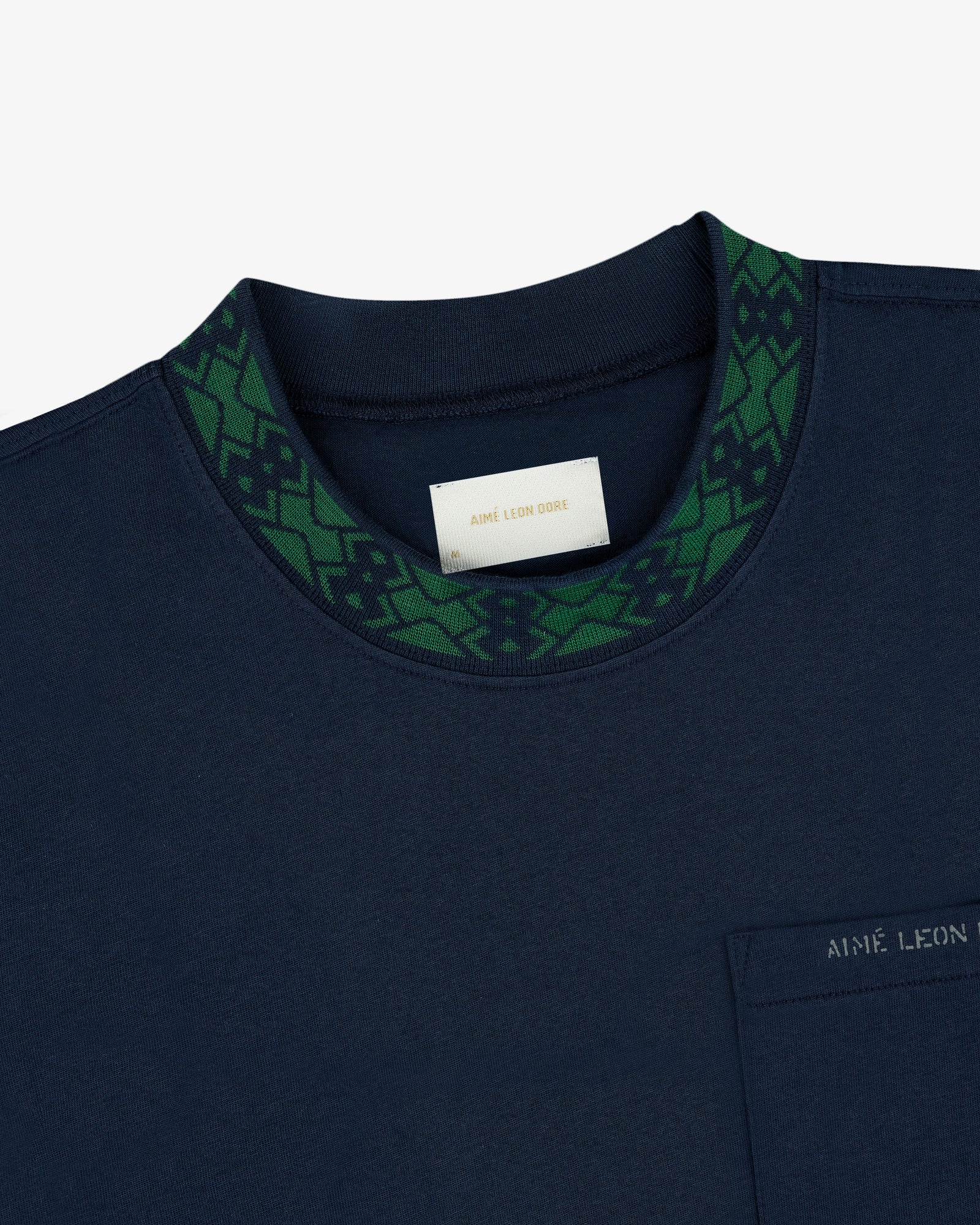 Navy Jacquard Collar Pocket Tee with green geometric collar, chest pocket, label: AIME LEON DORE.