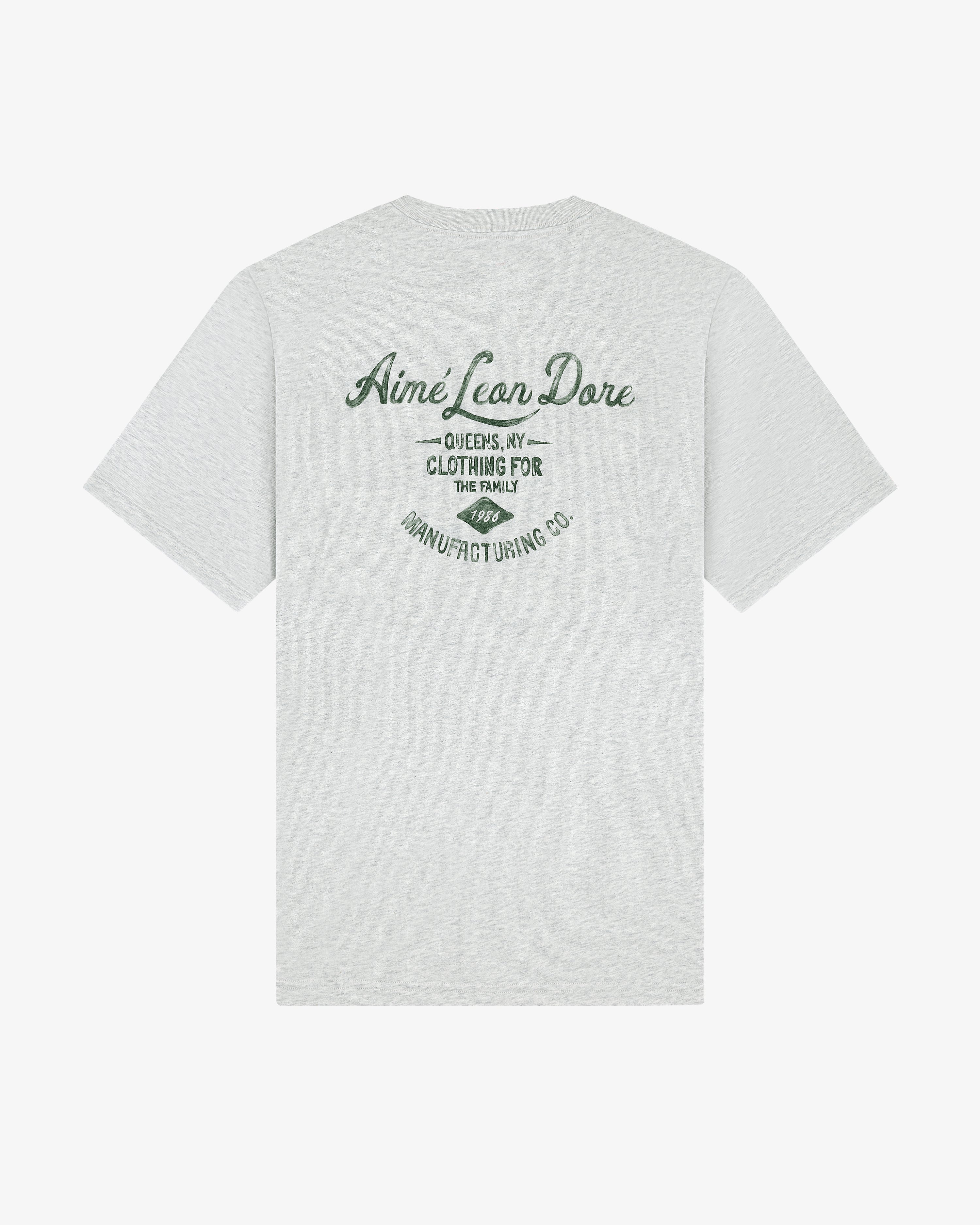 Light gray General Store Pocket Tee with green "Aimé Leon Dore, Queens, NY, Clothing for the Family" text on back.