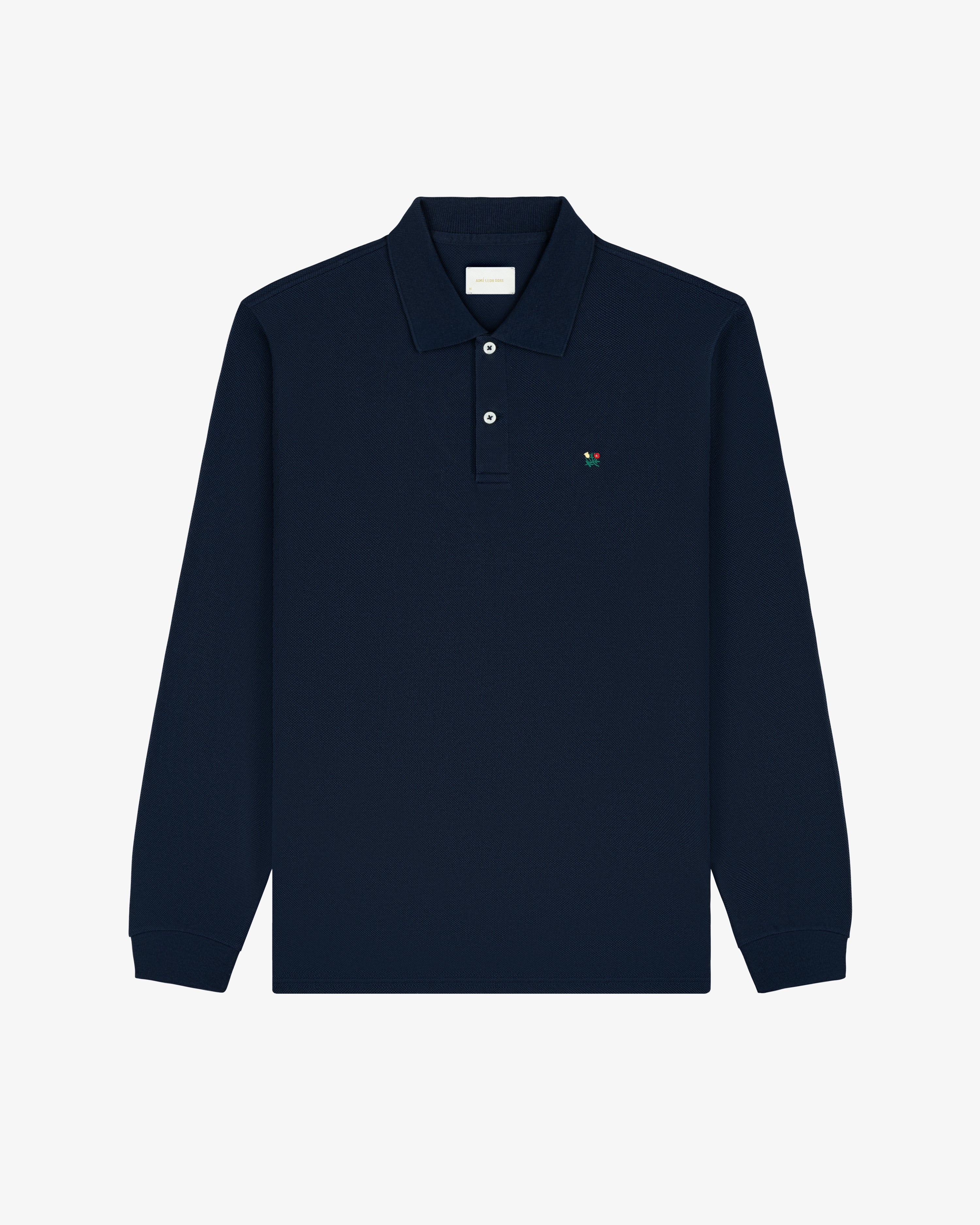 Long-Sleeve Crest Piqué Polo in navy with collar, buttons, and small embroidered chest logo.