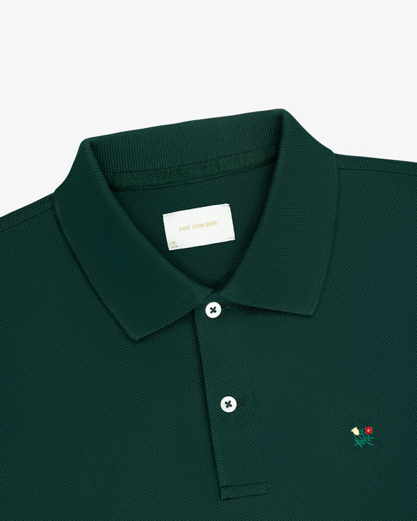 Long-Sleeve Crest Piqué Polo in dark green features a small chest flower and a white inner collar label.