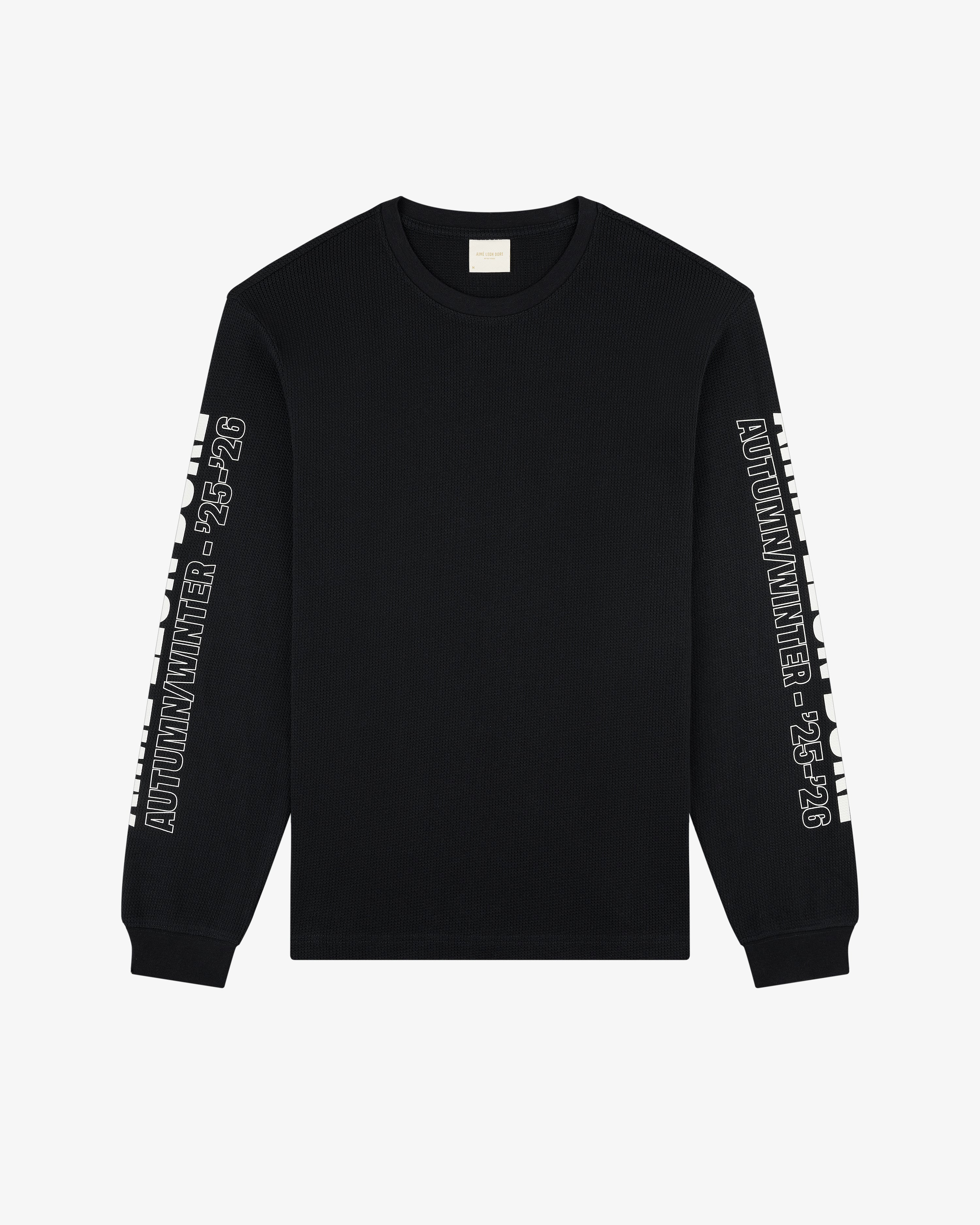 Long-Sleeve Mesh Moto Tee in black with AUTUMN/WINTER 23-24 text on sleeves, shown flat on a white background.