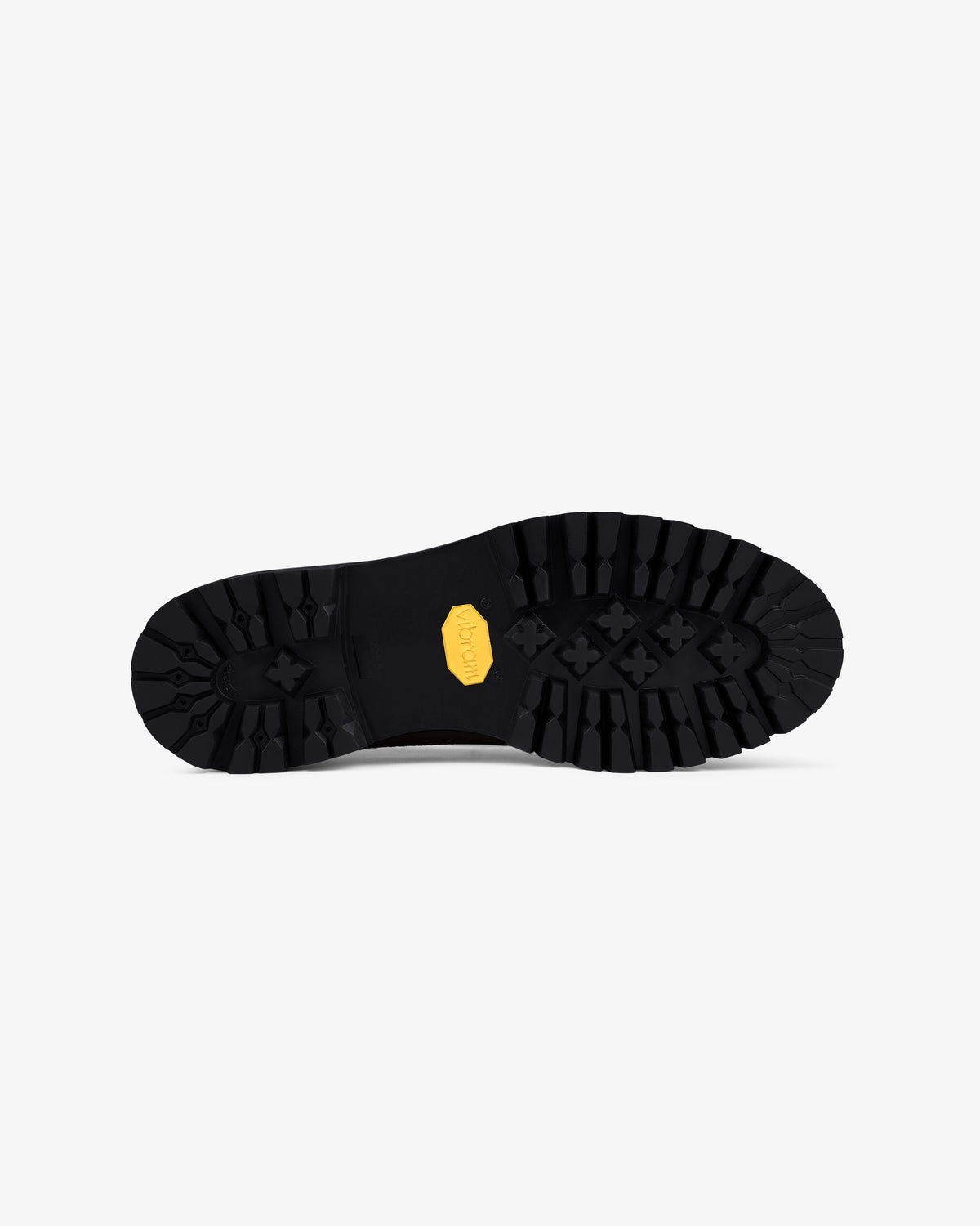 Lug Sole Queens Crest Loafer features a black rubber sole with deep treads and a yellow hexagonal logo, on white background.